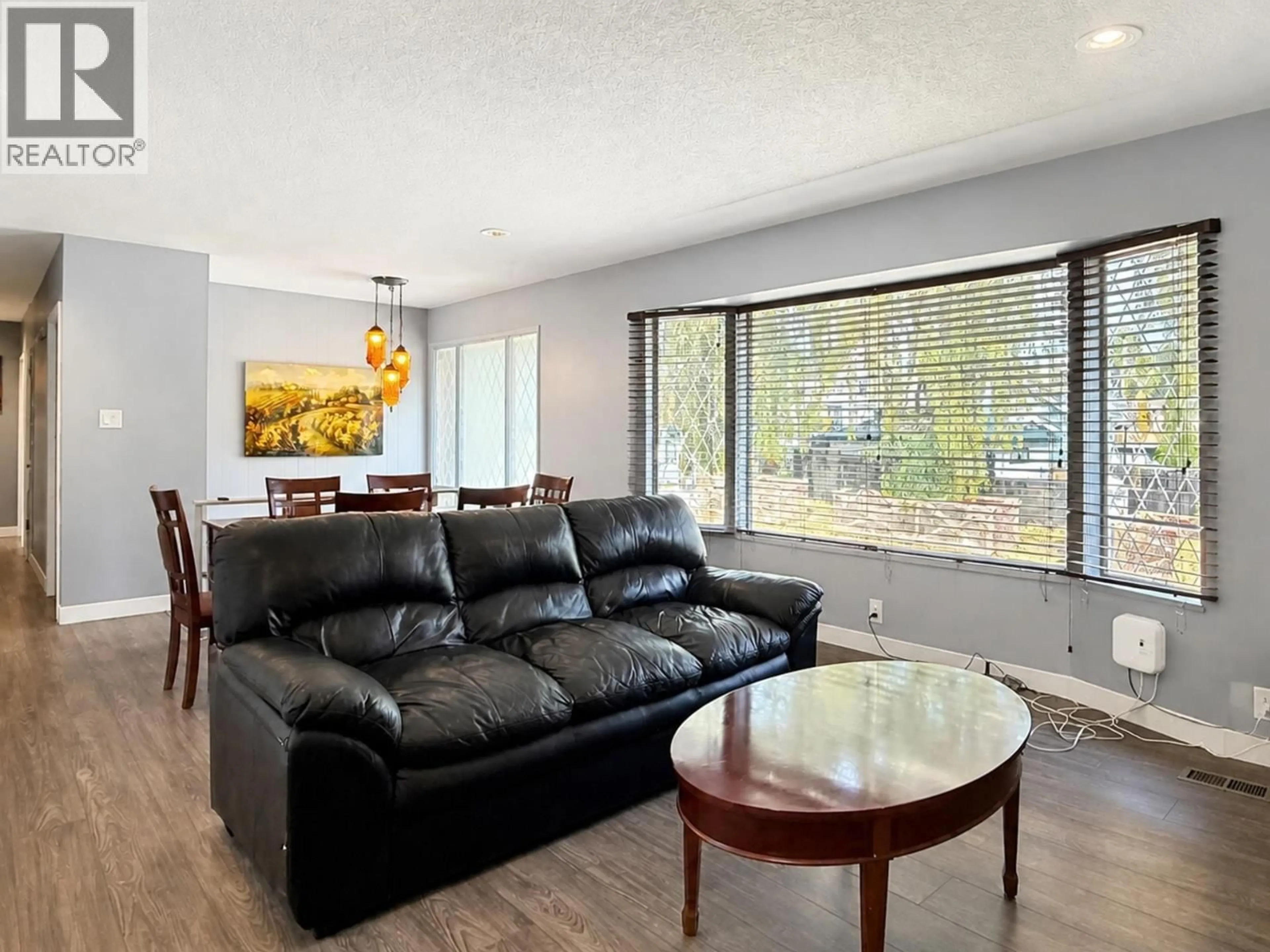 Living room with furniture, wood/laminate floor for 6175 QUEBEC STREET, Vancouver British Columbia V5W2P6