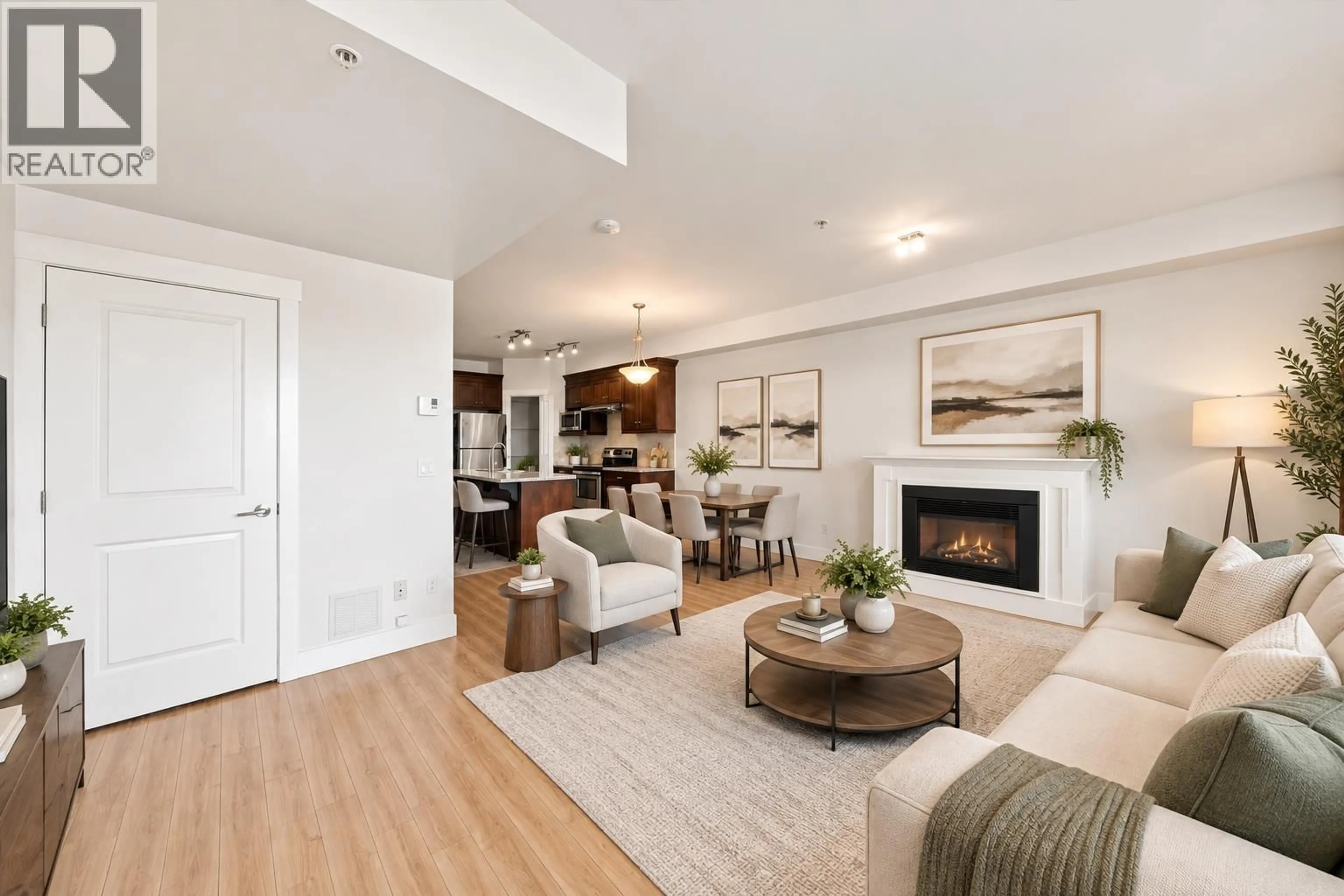 Living room with furniture, wood/laminate floor for 205 - 7908 GRAHAM AVENUE, Burnaby British Columbia V3N1V9