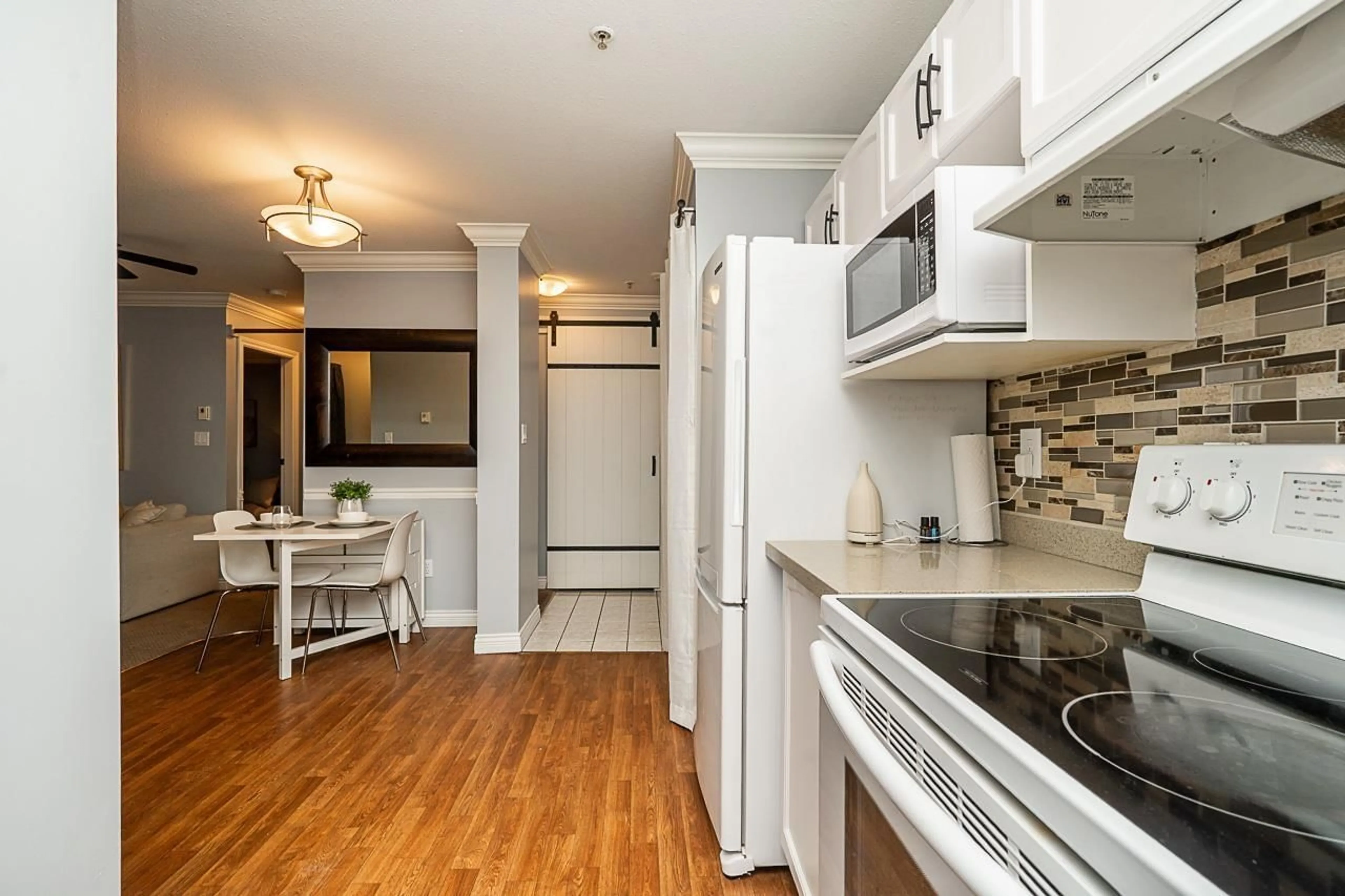 Standard kitchen, wood/laminate floor for 315 - 2962 TRETHEWEY STREET, Abbotsford British Columbia V2T4M3