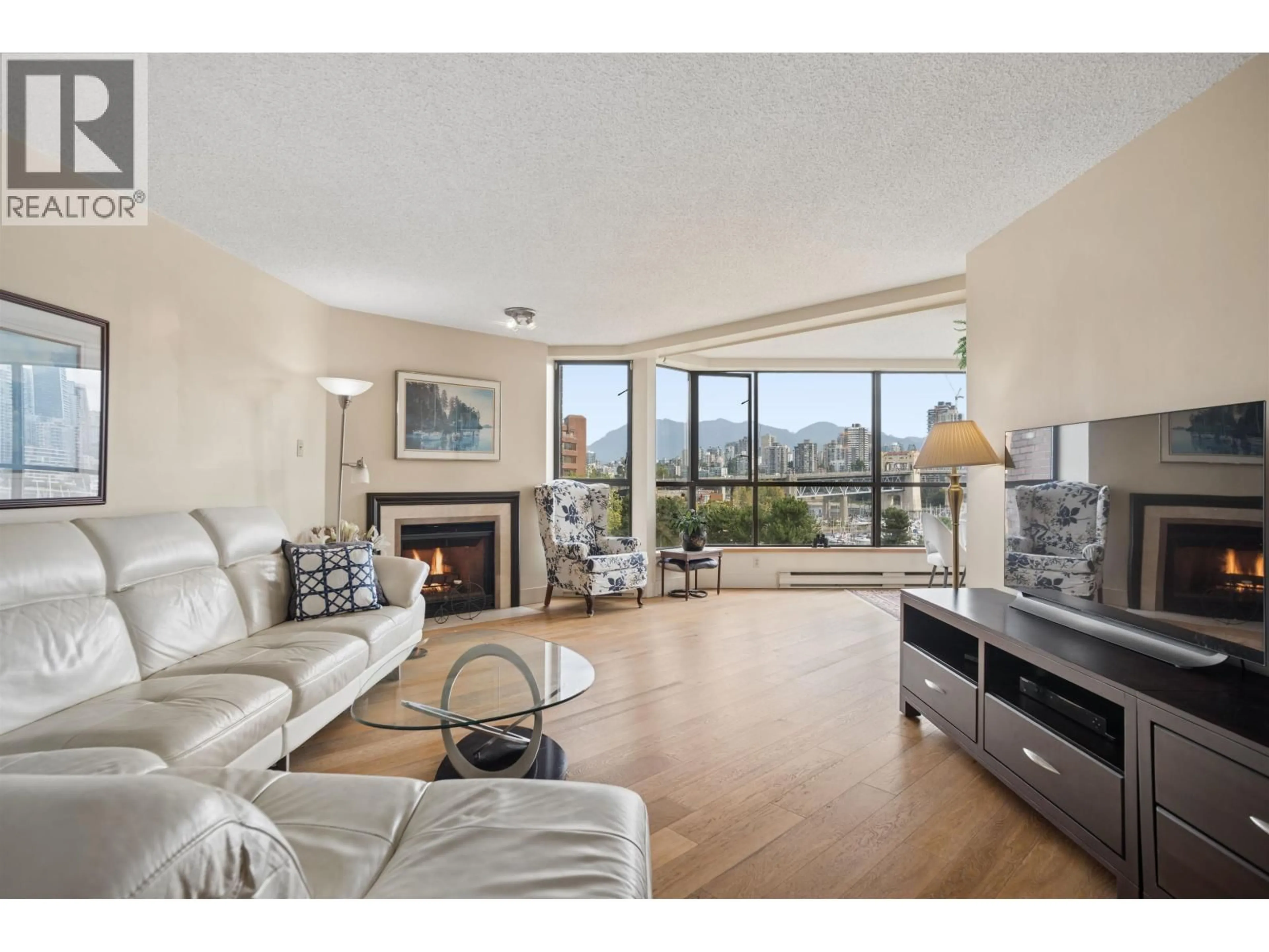 Living room with furniture, unknown for 602 - 1490 PENNYFARTHING DRIVE, Vancouver British Columbia V6J4Z3