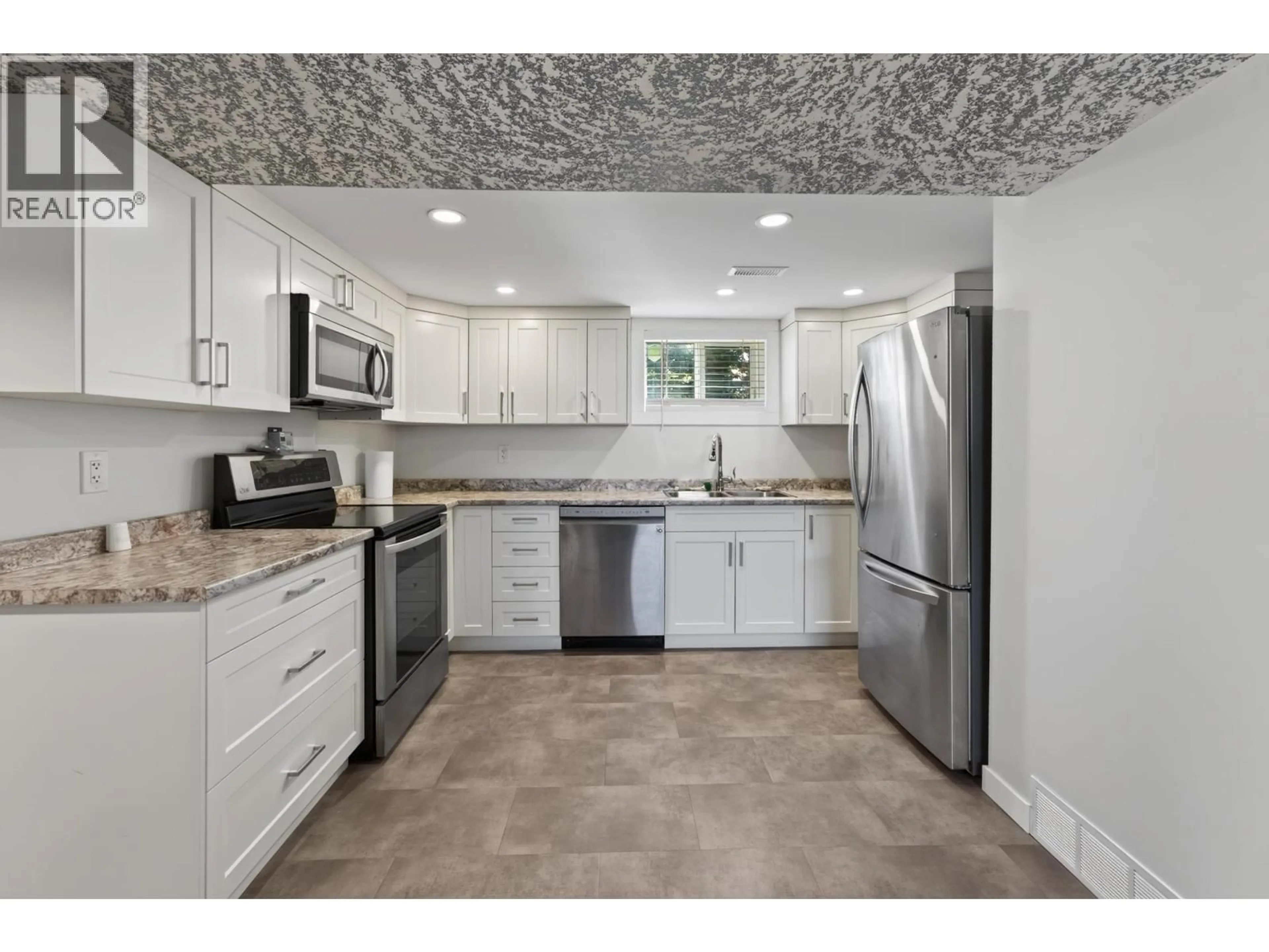Open concept kitchen, ceramic/tile floor for 2919 MCGILL CRESCENT, Prince George British Columbia V2N2M7