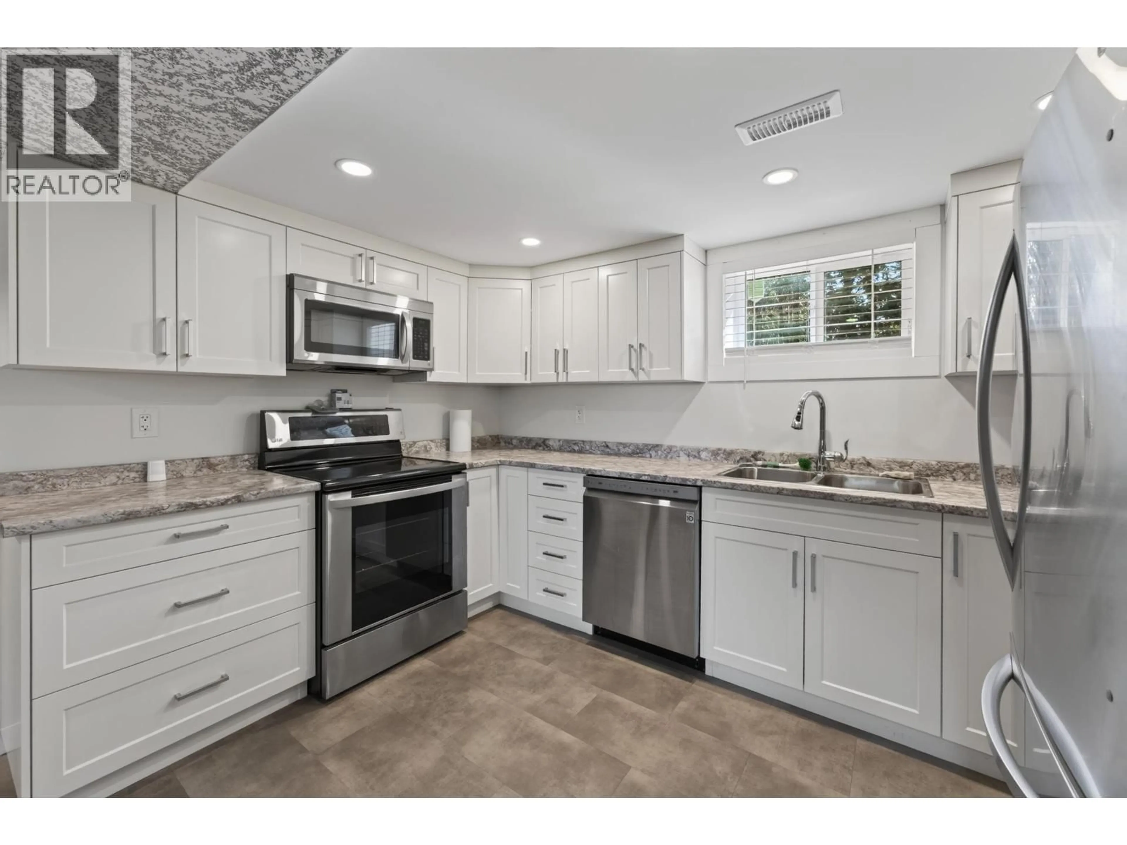 Open concept kitchen, ceramic/tile floor for 2919 MCGILL CRESCENT, Prince George British Columbia V2N2M7