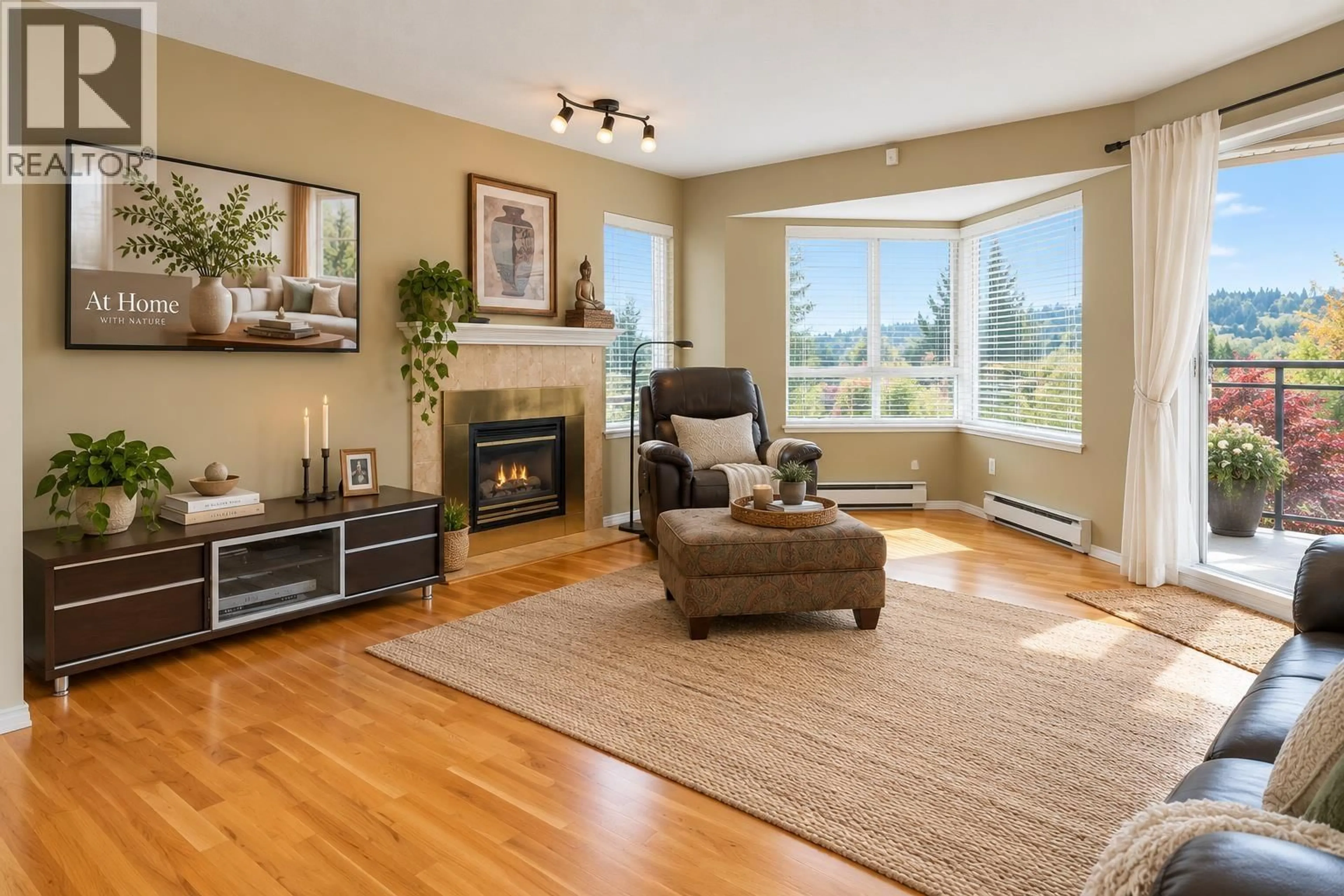 Living room with furniture, wood/laminate floor for 406 - 1215 LANSDOWNE DRIVE, Coquitlam British Columbia V3E2P2