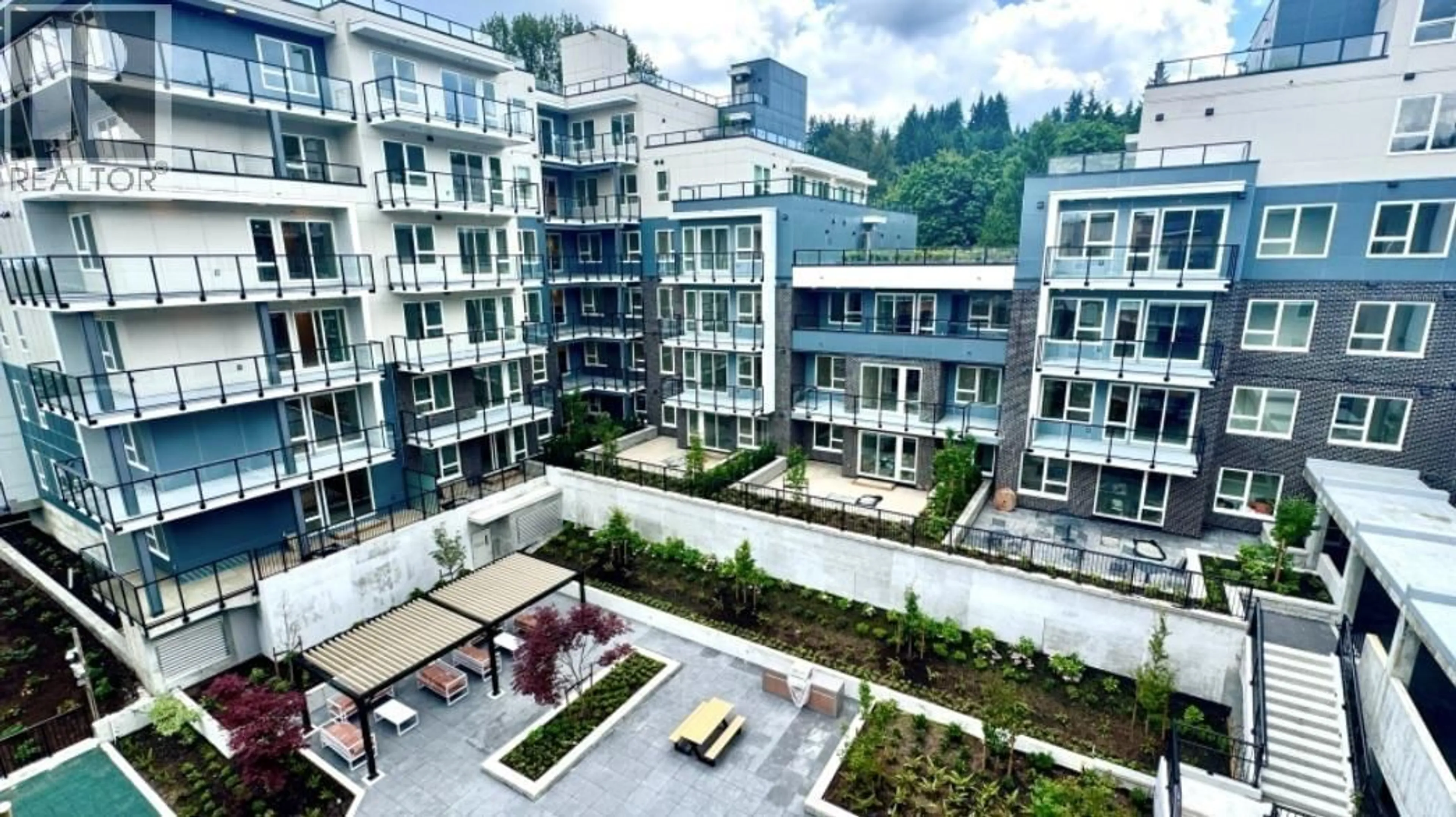 Patio, city buildings view from balcony for 411 - 1100 CLARKE ROAD, Port Moody British Columbia V3H0N3