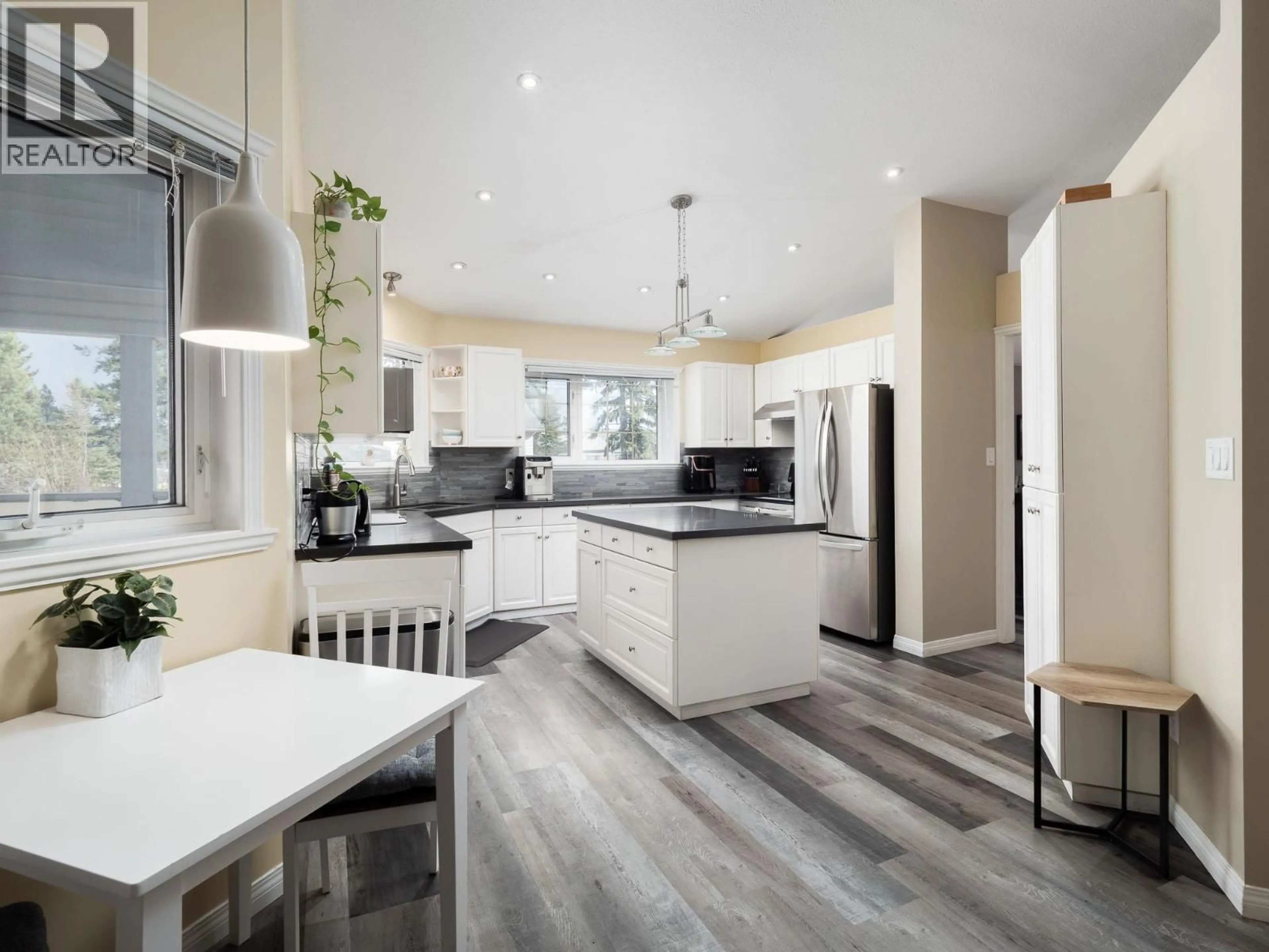 Open concept kitchen, wood/laminate floor for 1585 EDMONTON STREET, Prince George British Columbia V2M1X5