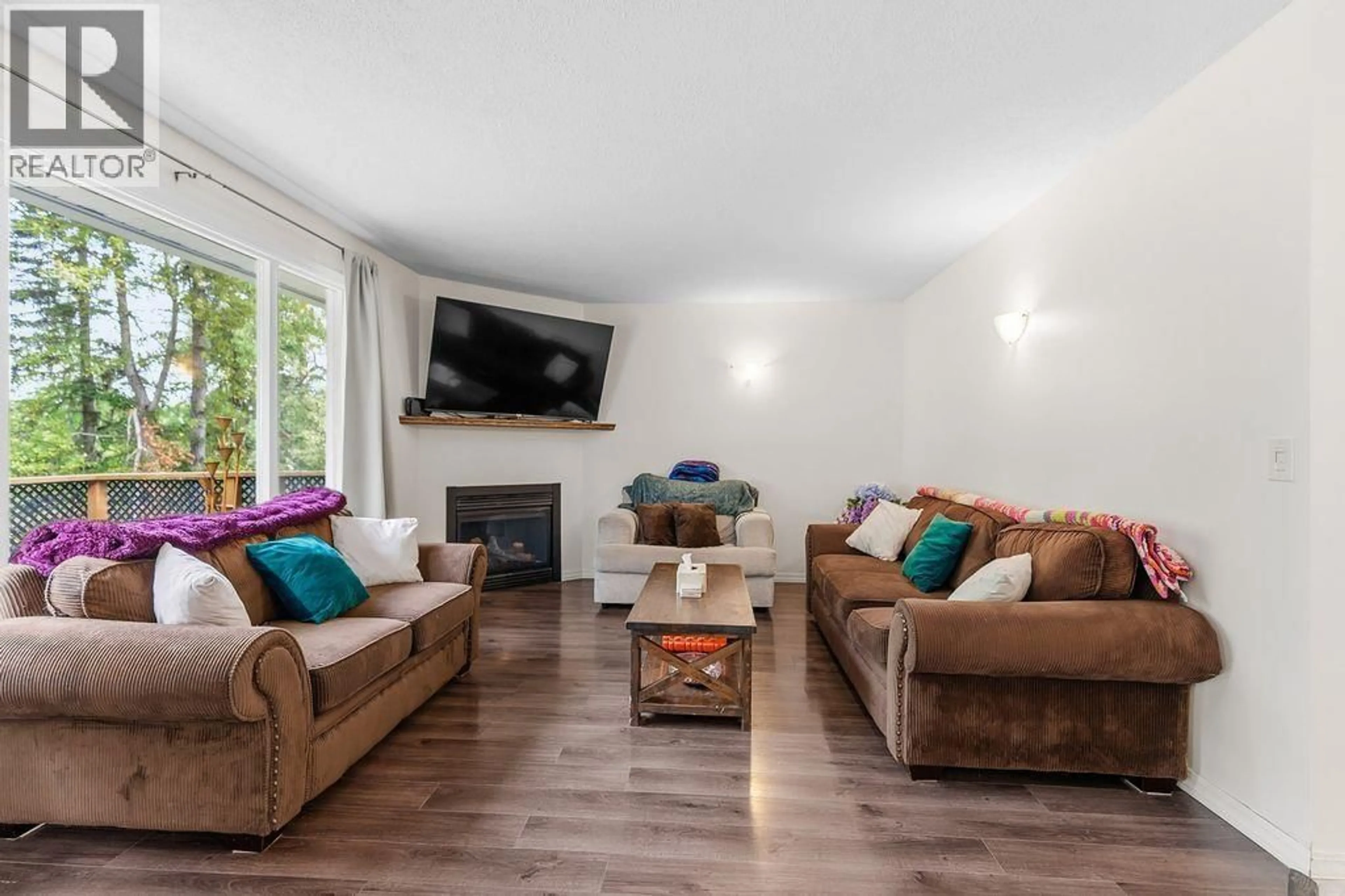Living room with furniture, wood/laminate floor for 2236 CROFT ROAD, Prince George British Columbia V2K3W4