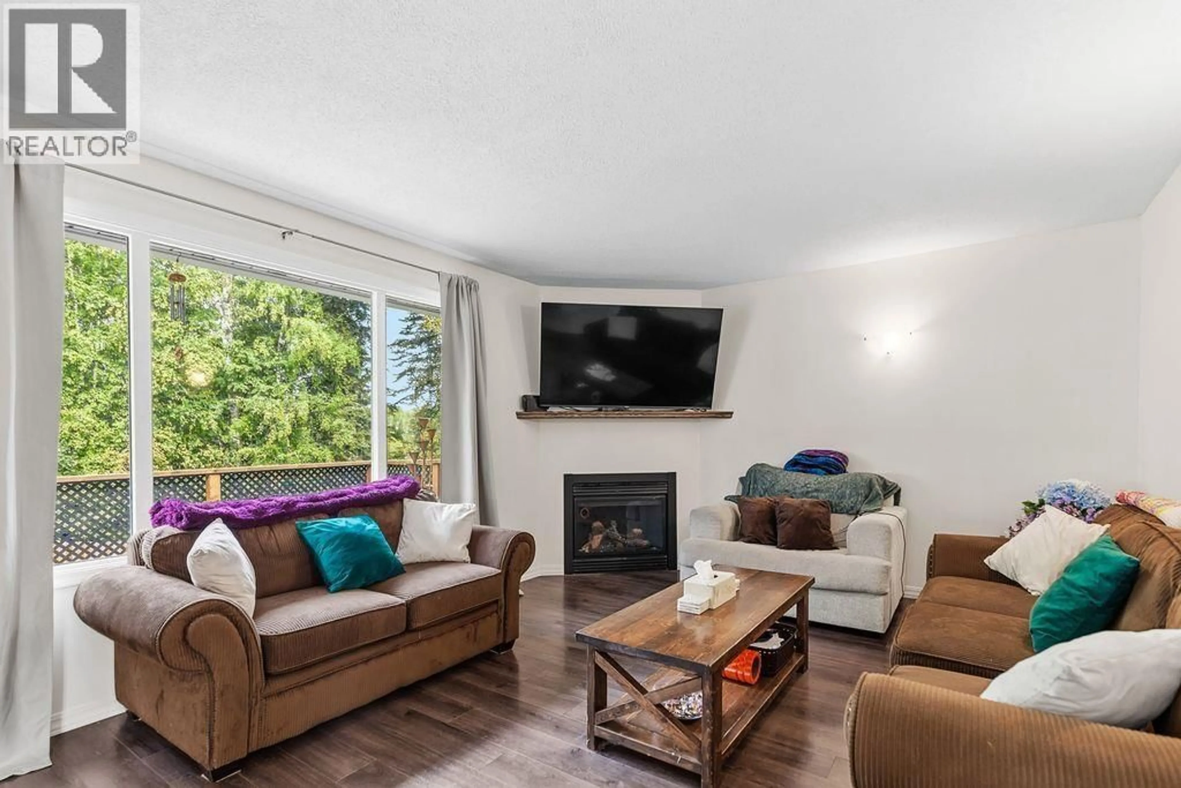 Living room with furniture, wood/laminate floor for 2236 CROFT ROAD, Prince George British Columbia V2K3W4