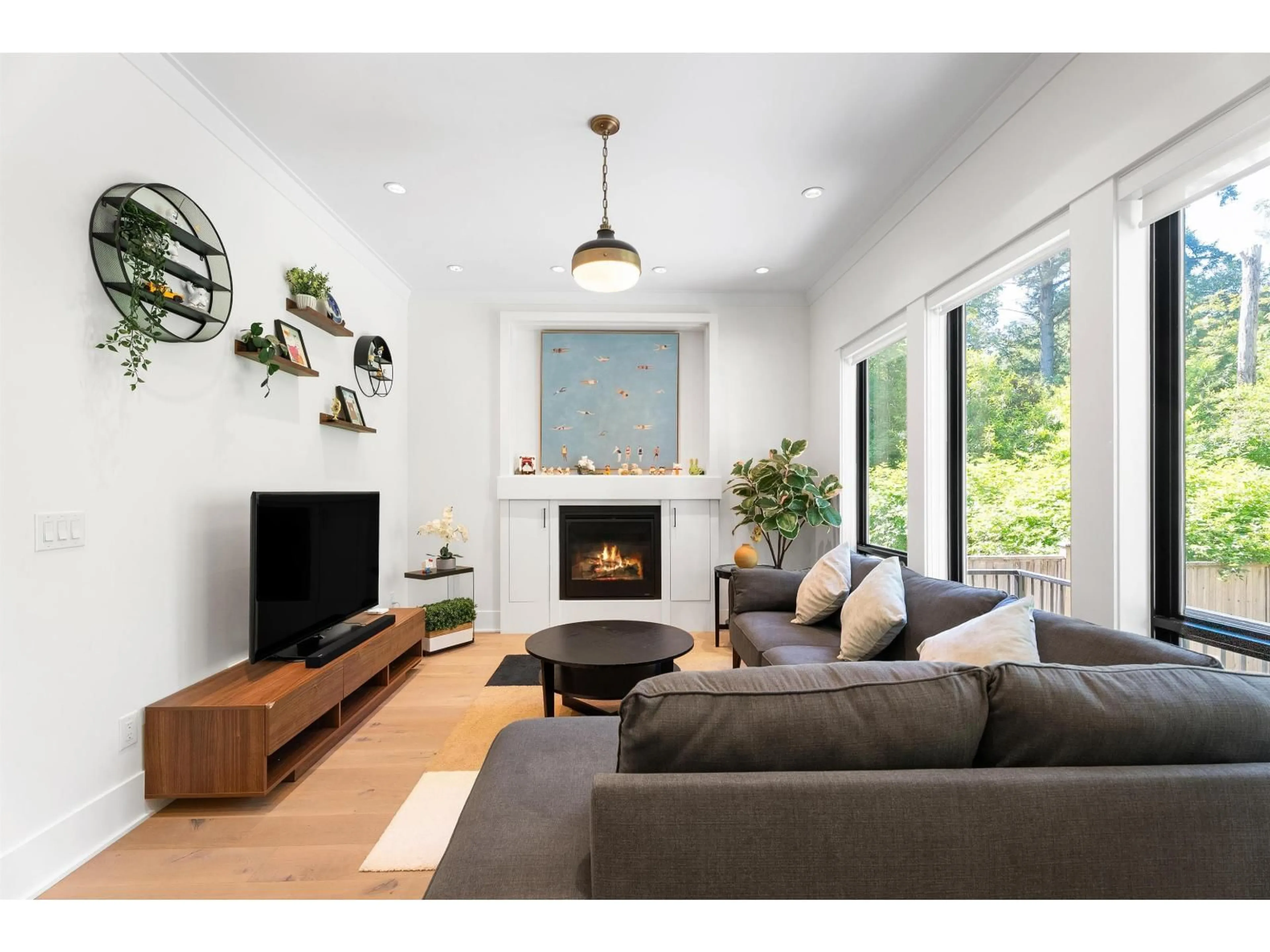 Living room with furniture, wood/laminate floor for 3323 147 STREET, Surrey British Columbia V4P1Z8