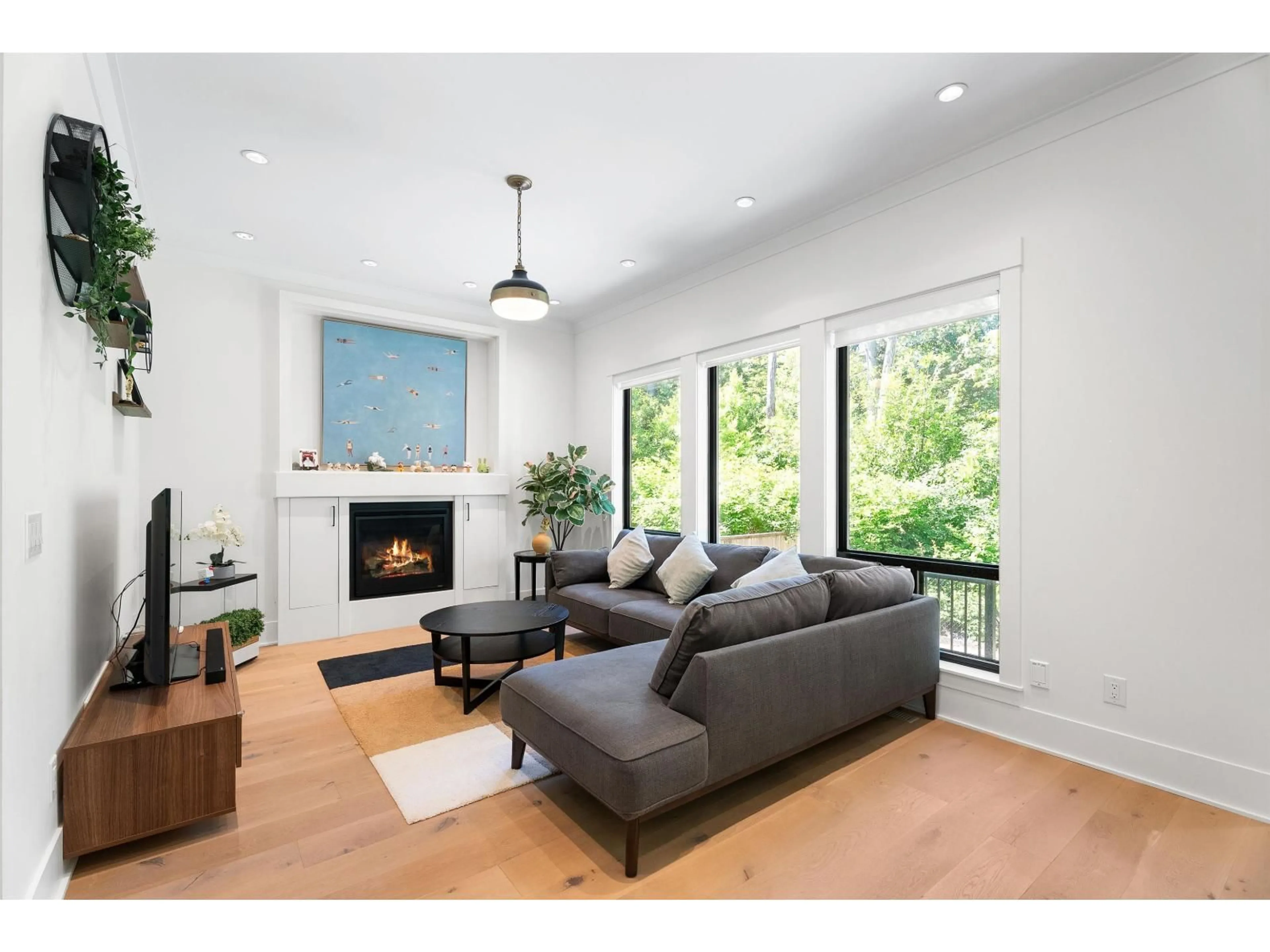 Living room with furniture, wood/laminate floor for 3323 147 STREET, Surrey British Columbia V4P1Z8