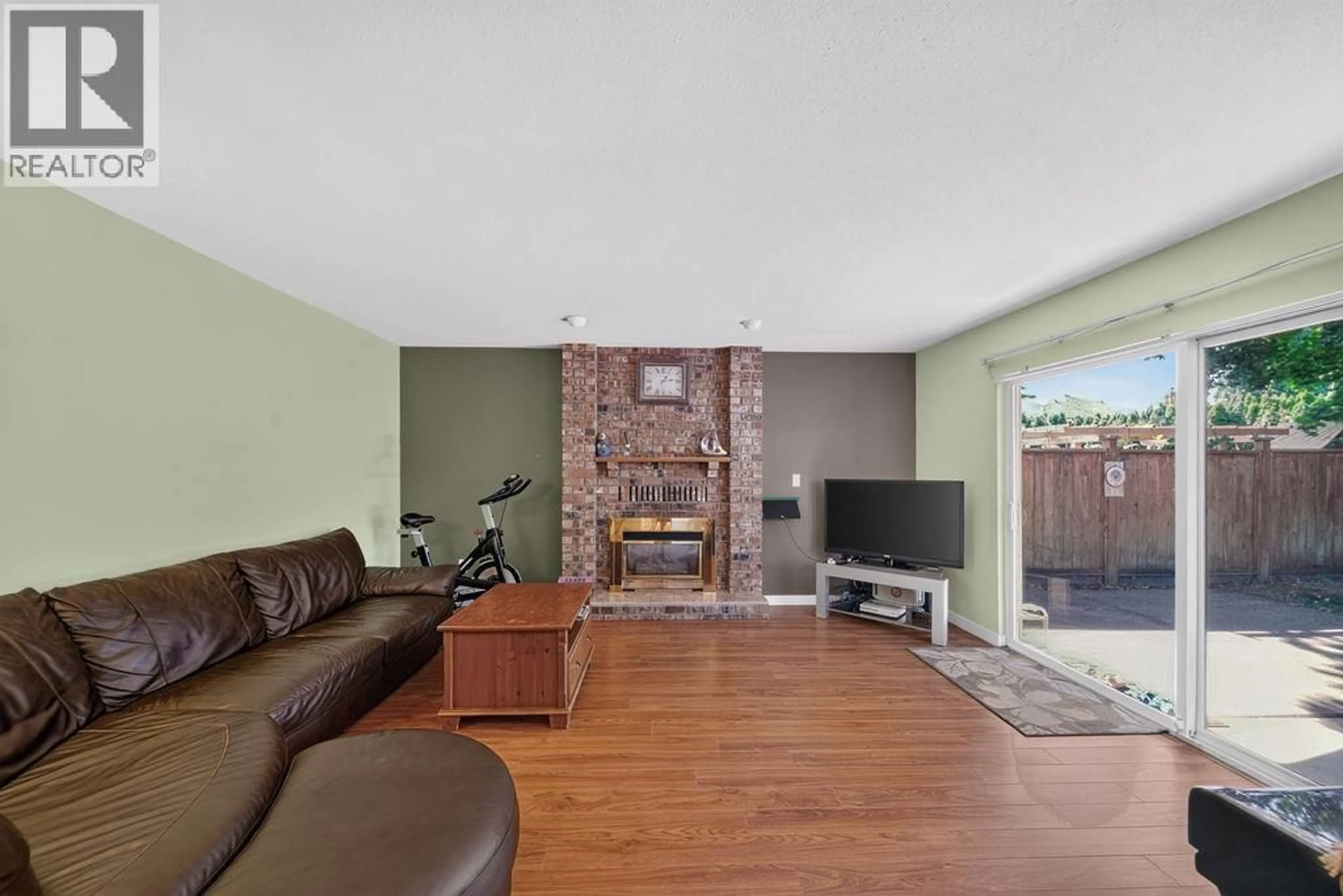 Living room with furniture, wood/laminate floor for 6391 BOUCHARD COURT, Richmond British Columbia V7C5W3