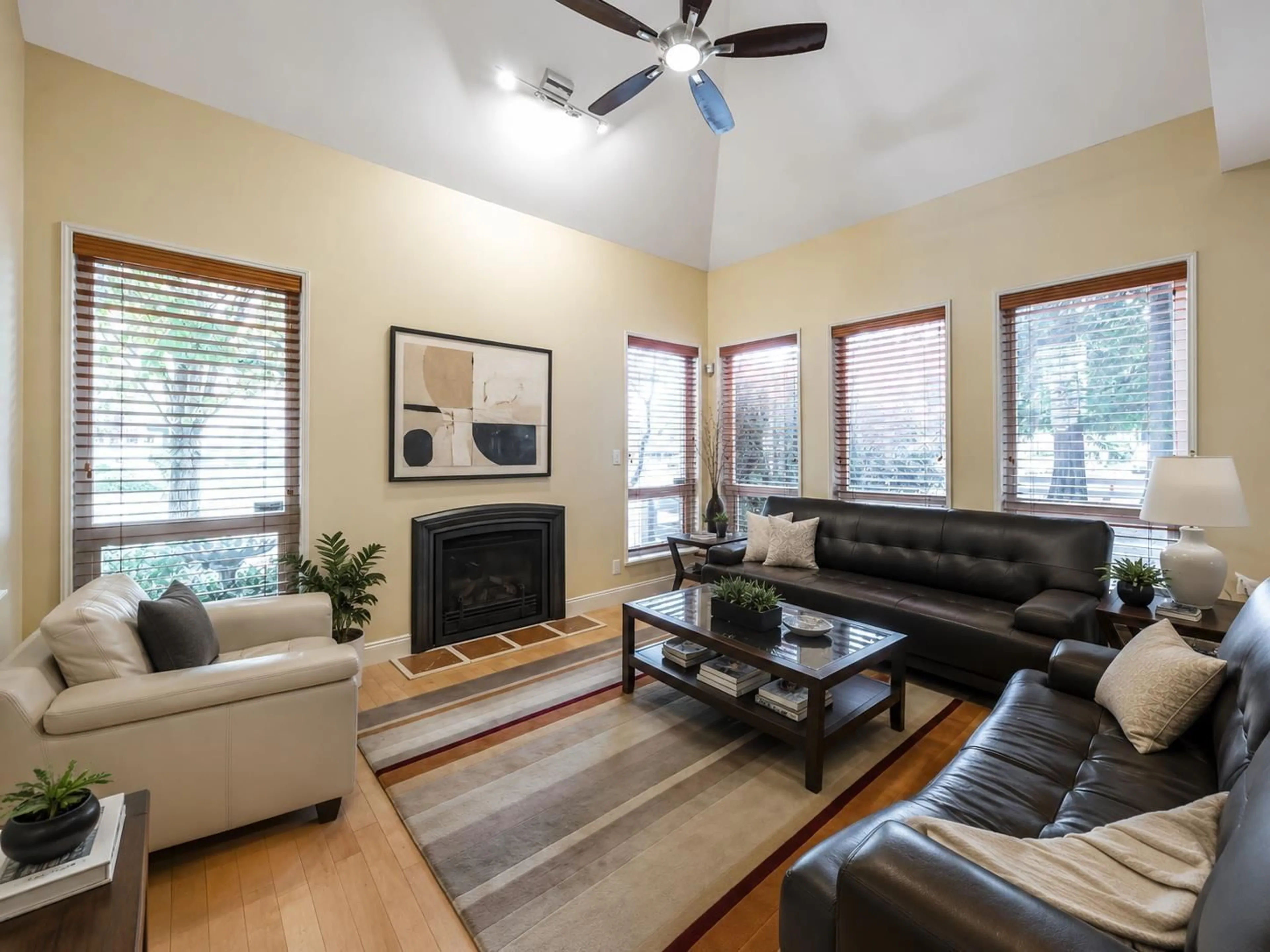 Living room with furniture, wood/laminate floor for 8 - 15055 20 AVENUE, Surrey British Columbia V4A9Y2