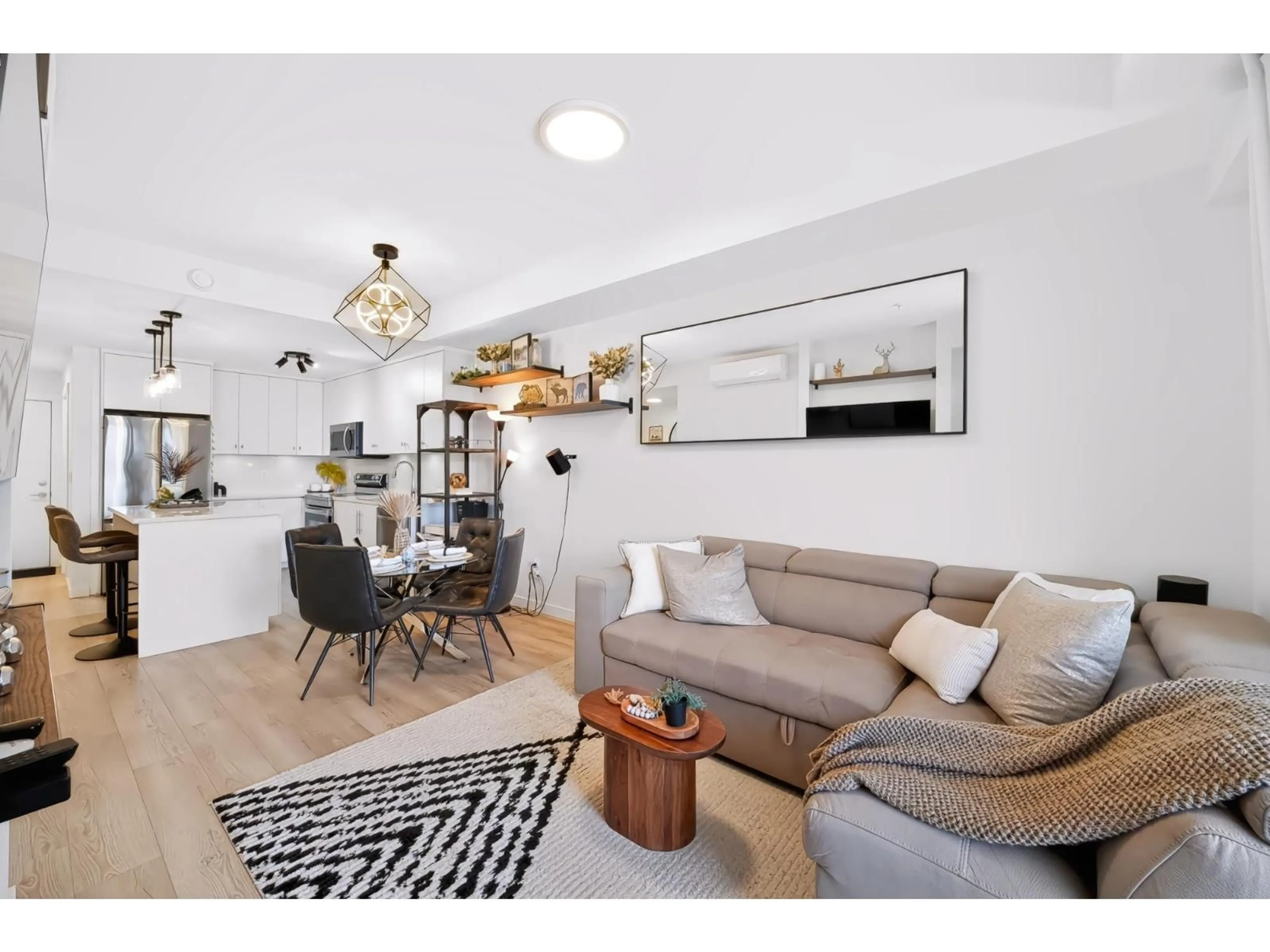Living room with furniture, wood/laminate floor for 303 - 5420 208 STREET, Langley British Columbia V3A2J9