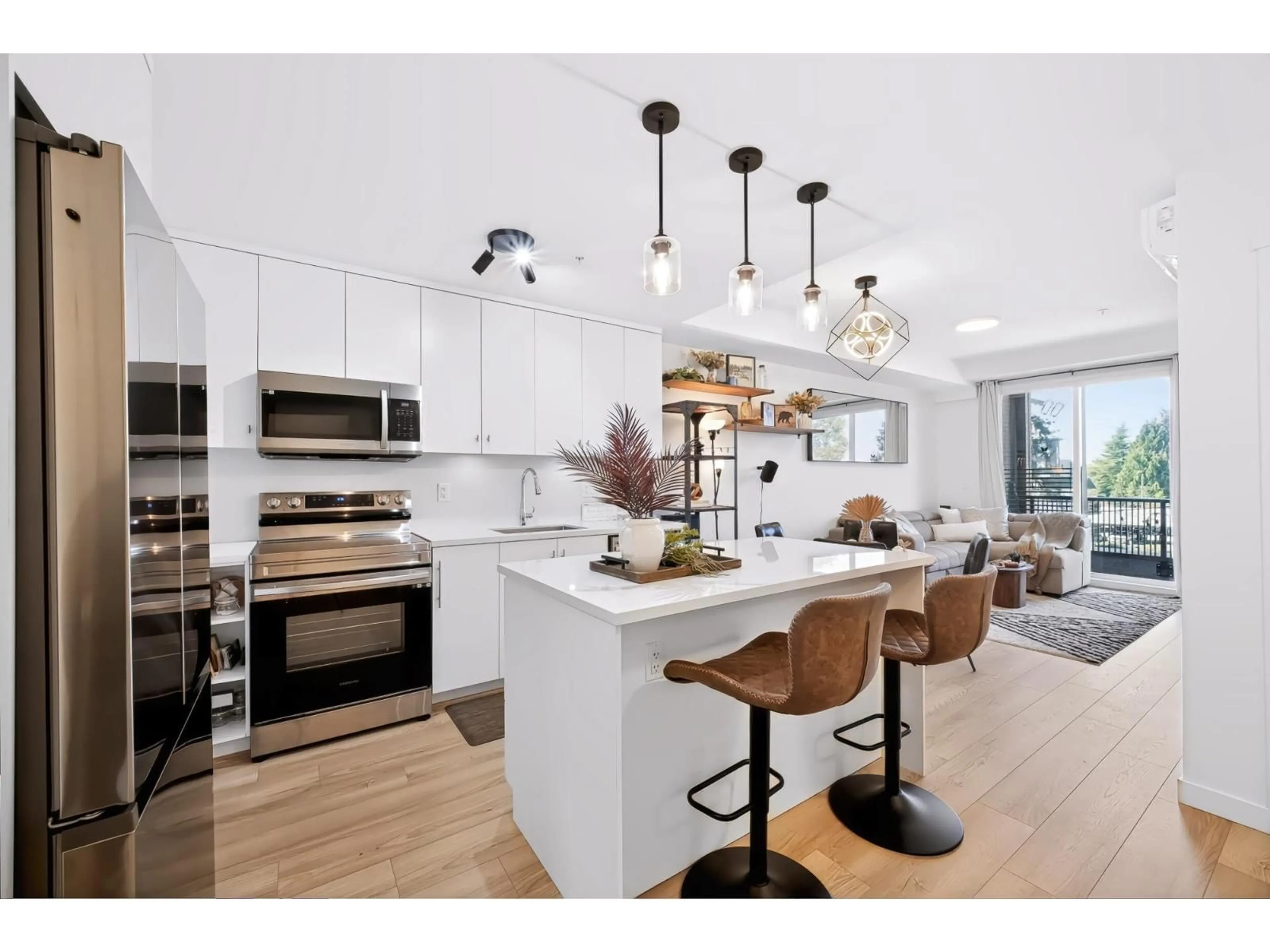 Open concept kitchen, wood/laminate floor for 303 - 5420 208 STREET, Langley British Columbia V3A2J9