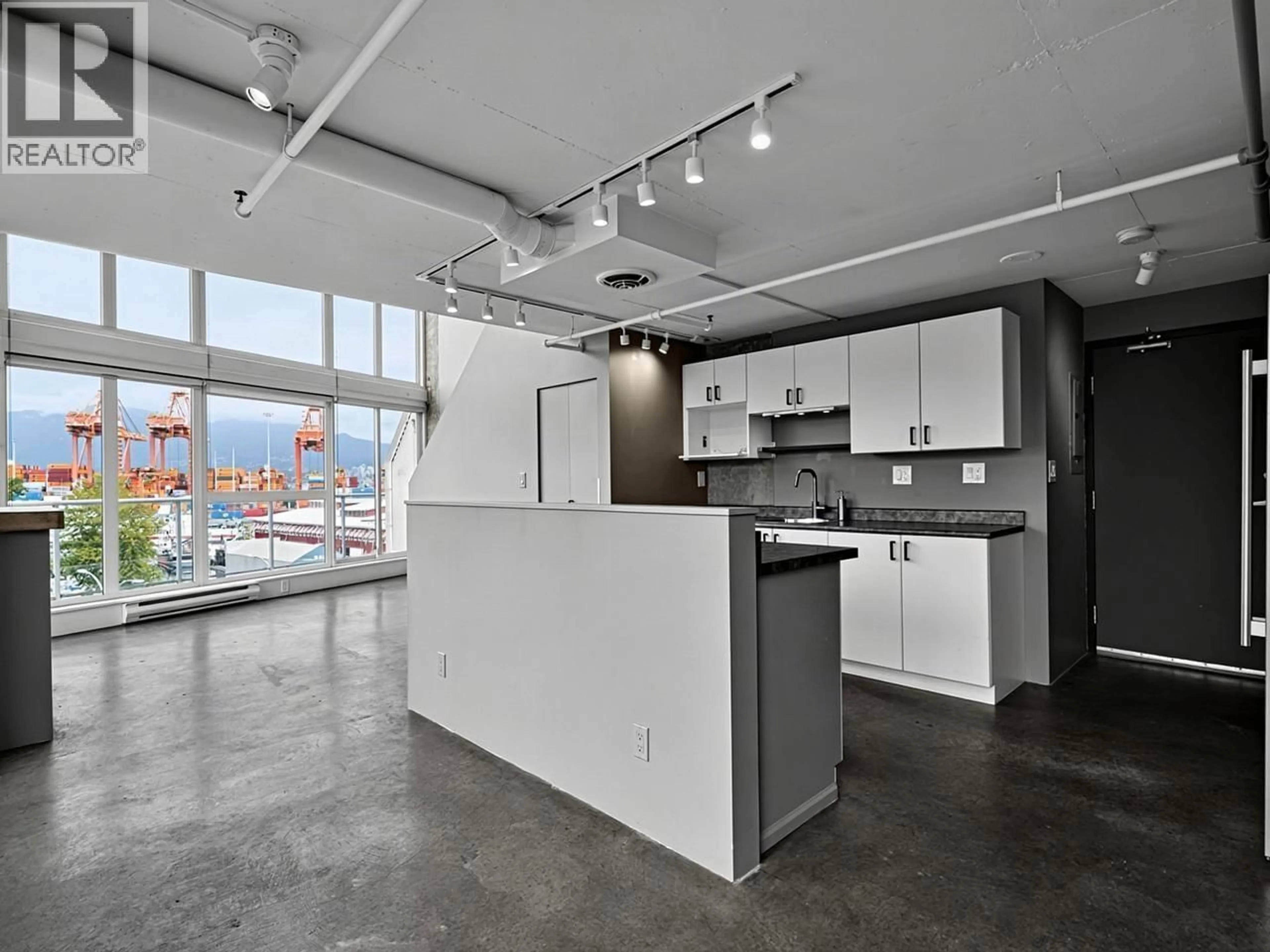 Open concept kitchen, cement floor for 429 - 289 ALEXANDER STREET, Vancouver British Columbia V6A4H6
