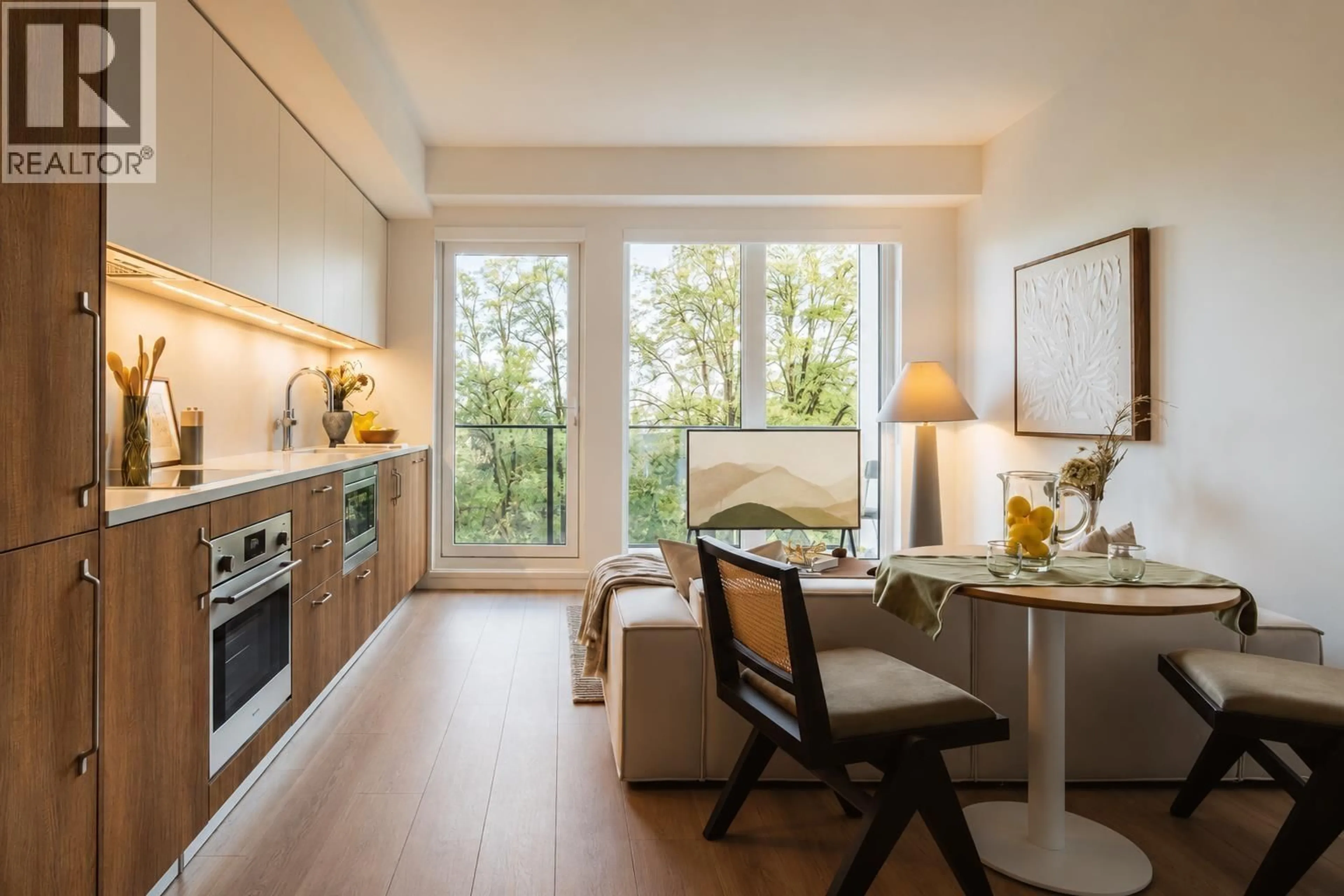 Open concept kitchen, wood/laminate floor for 422 - 133 49TH AVENUE, Vancouver British Columbia V5Z2S3