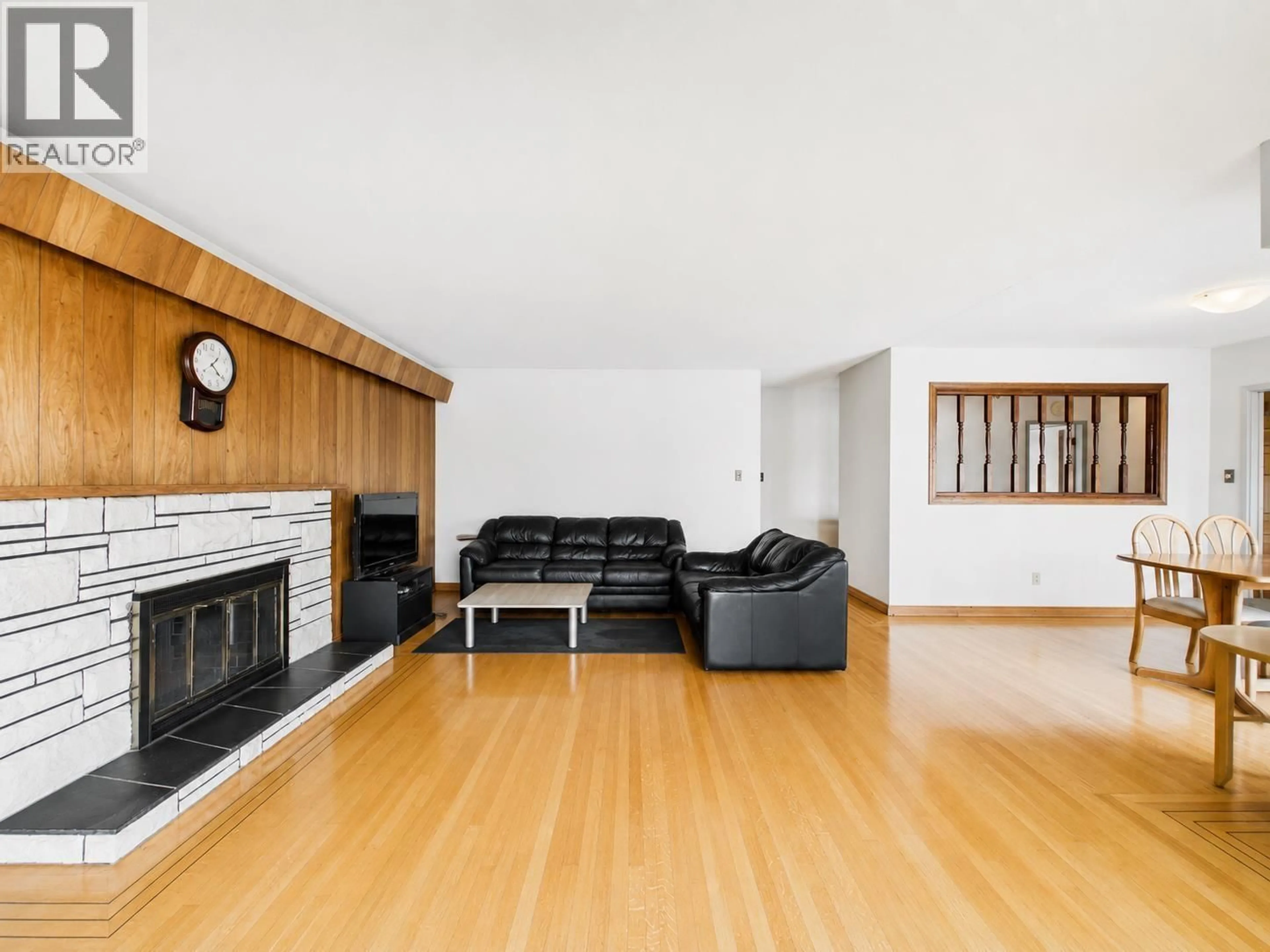 Living room with furniture, wood/laminate floor for 6096 SERVICE STREET, Burnaby British Columbia V5H1V8
