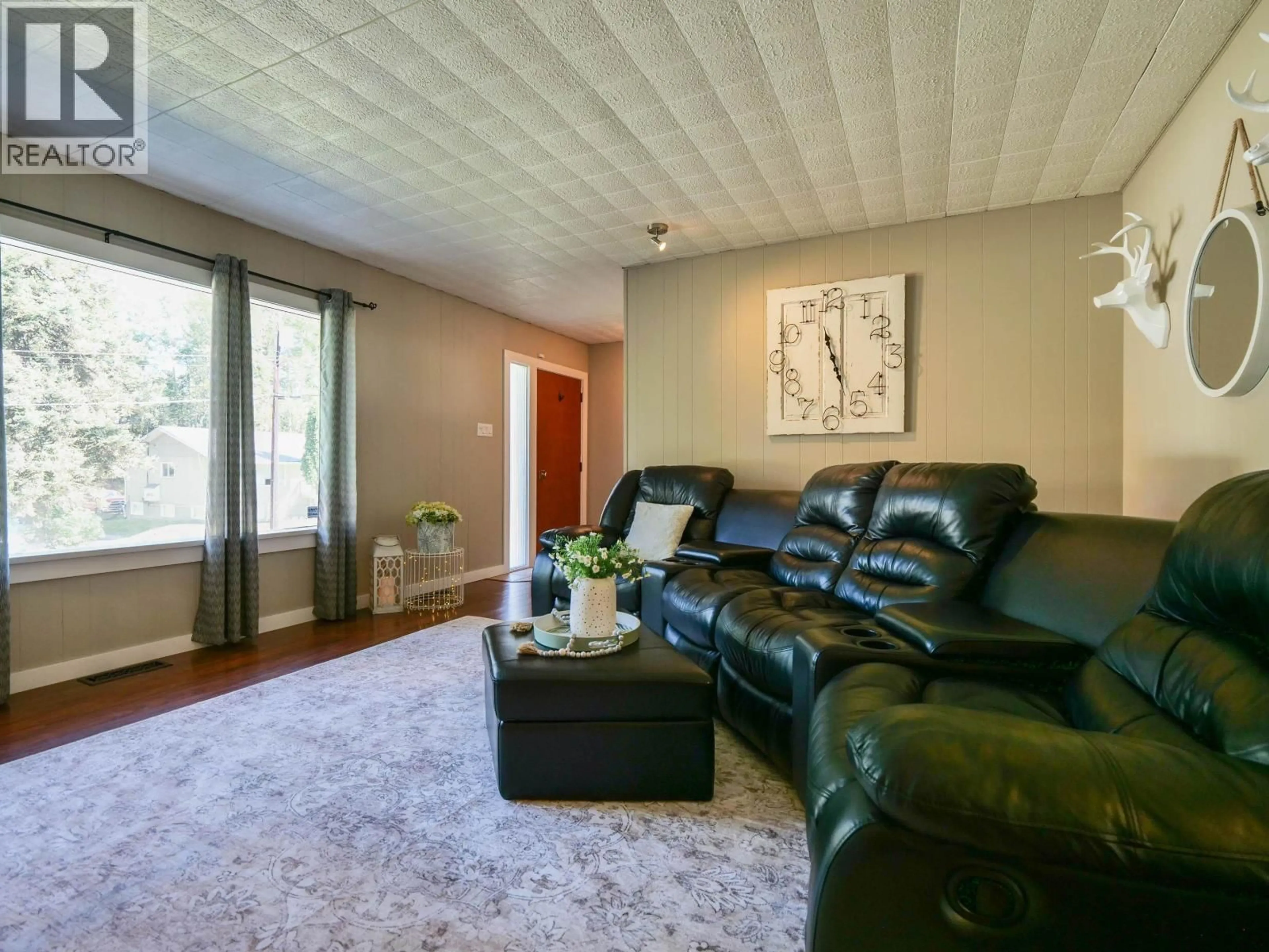 Living room with furniture, wood/laminate floor for 108 GORDON AVENUE, Quesnel British Columbia V2J2J3