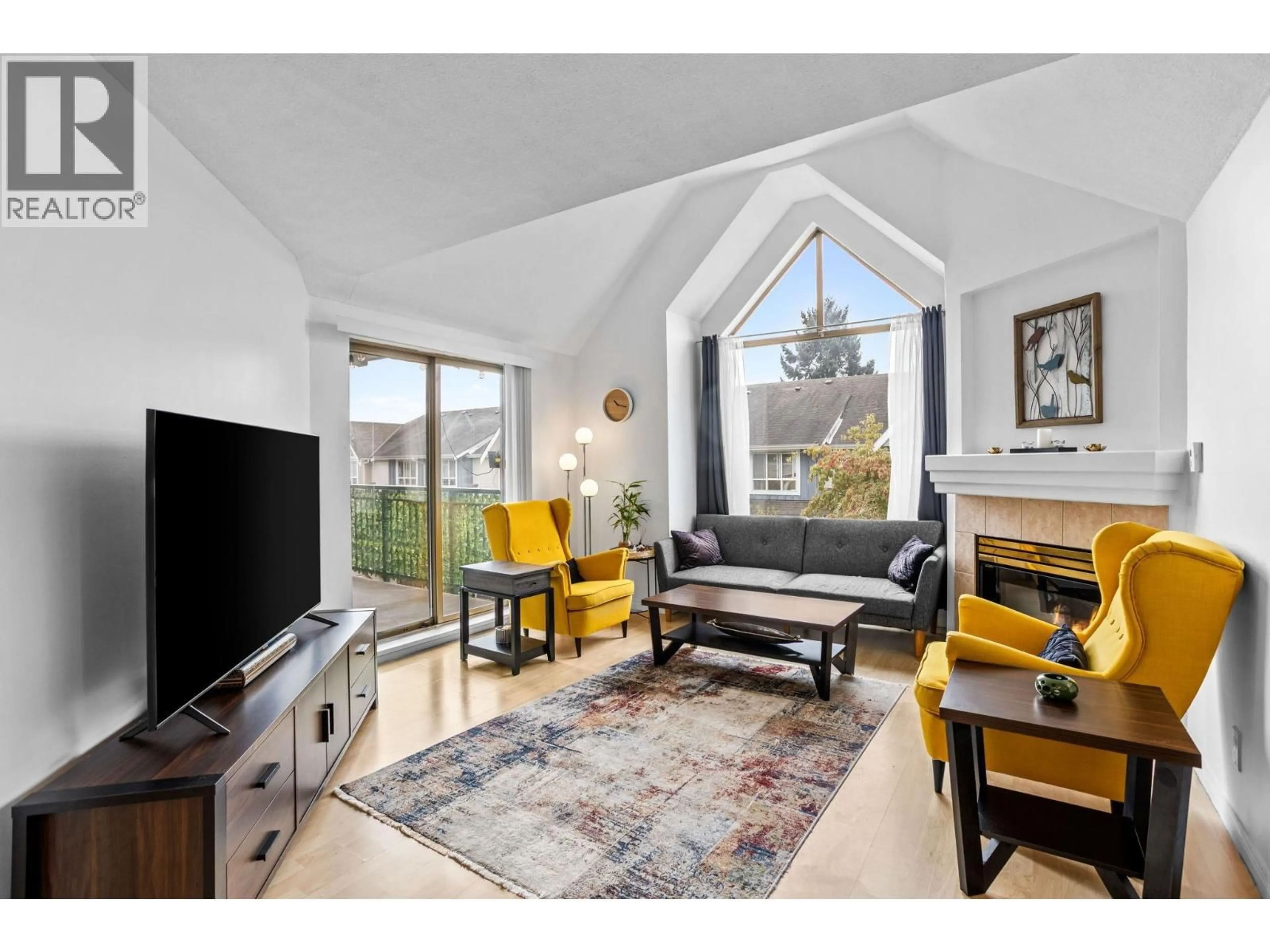 Living room with furniture, wood/laminate floor for 304 - 1650 GRANT AVENUE, Port Coquitlam British Columbia V3B7V2