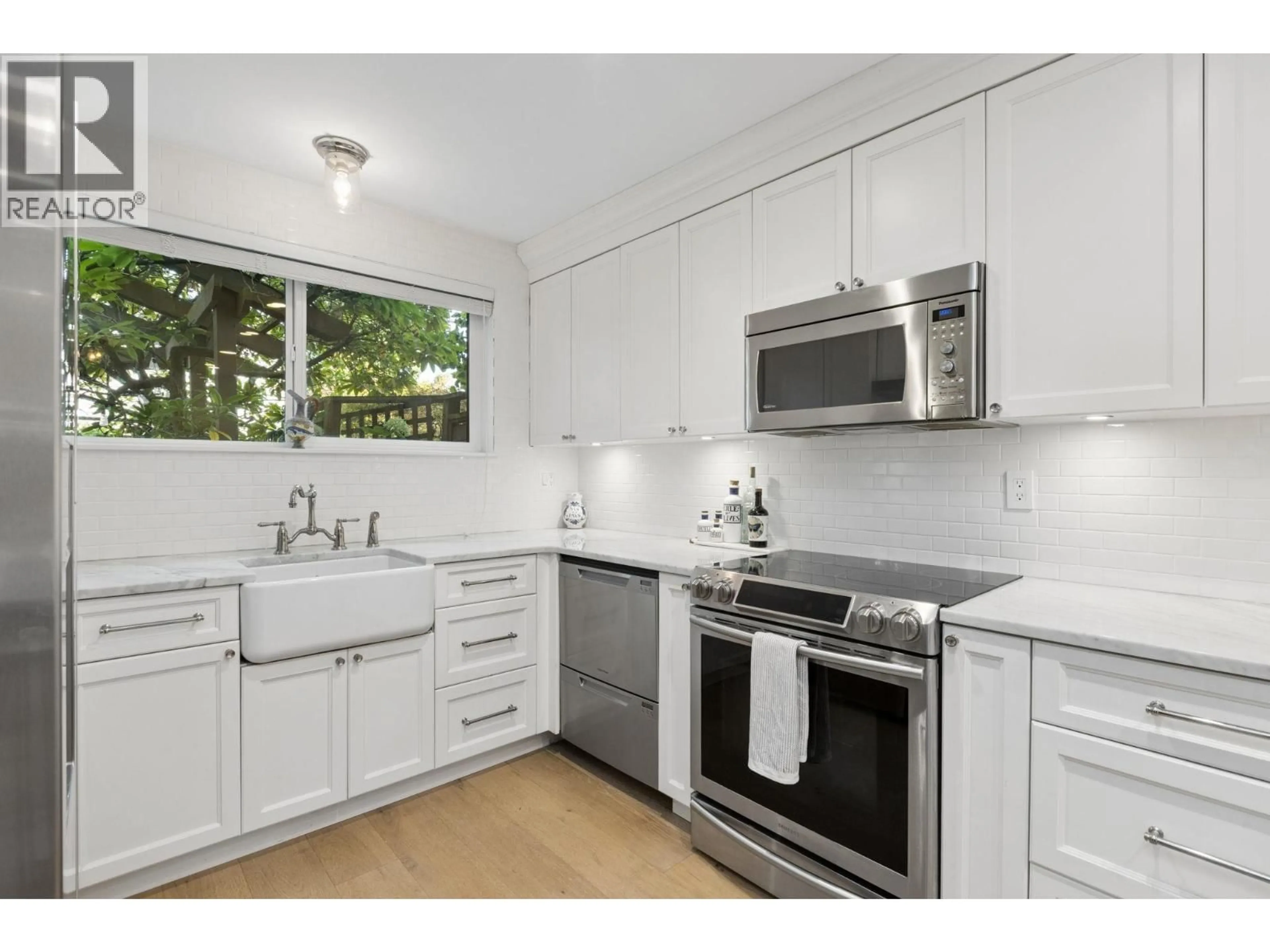 Standard kitchen, ceramic/tile floor for 104 - 2211 WEST 2ND AVE, Vancouver British Columbia V6K1H8