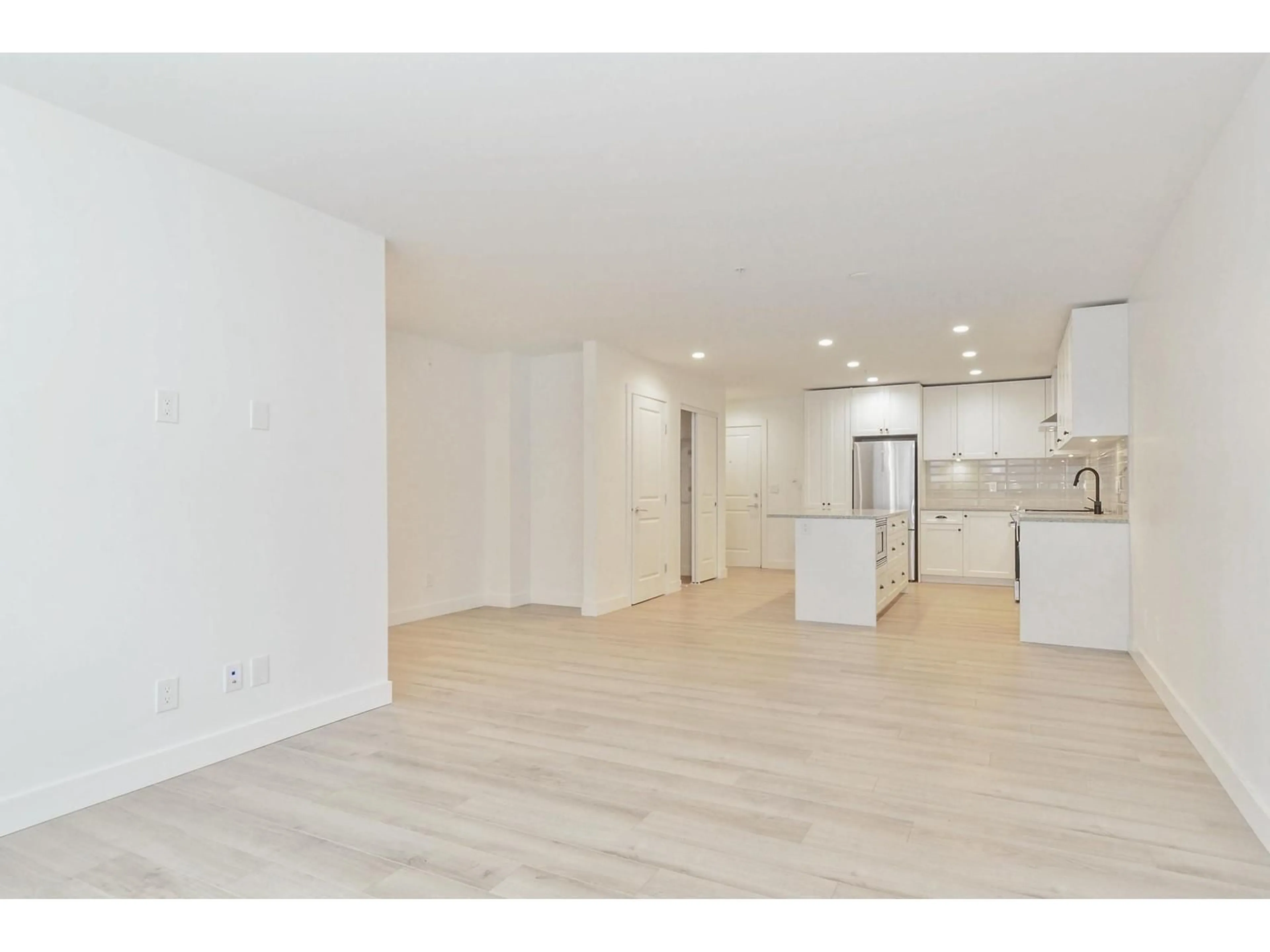 Open concept kitchen, wood/laminate floor for A108 - 20487 65 AVENUE, Langley British Columbia V2Y3K5