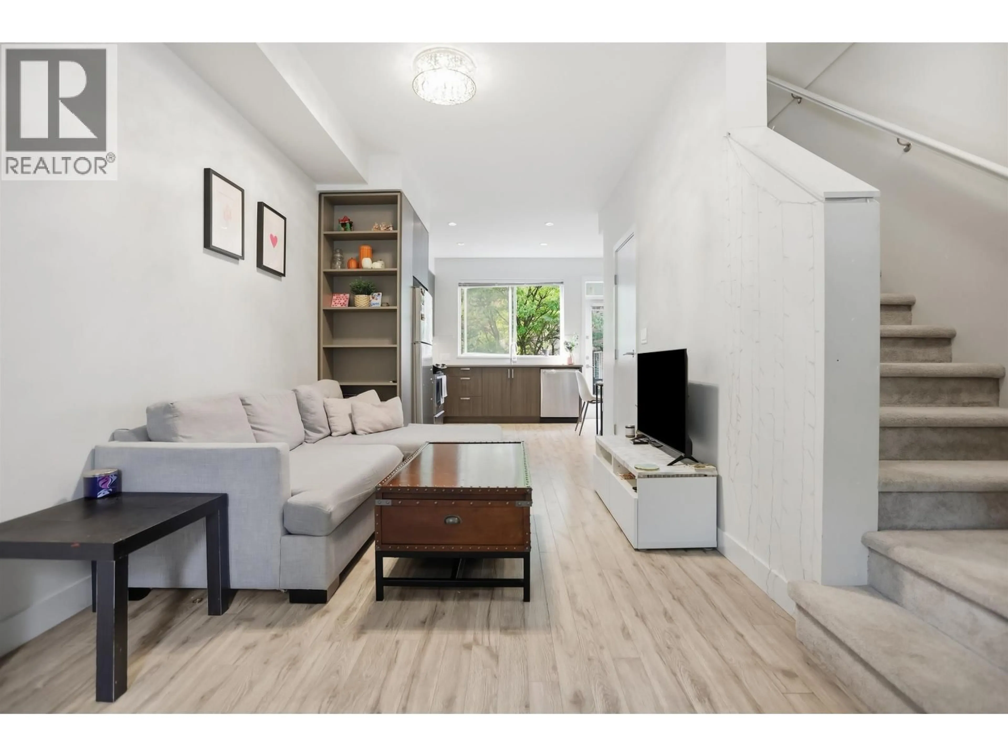 Living room with furniture, wood/laminate floor for 32 - 7458 BRITTON STREET, Burnaby British Columbia V3N3A5