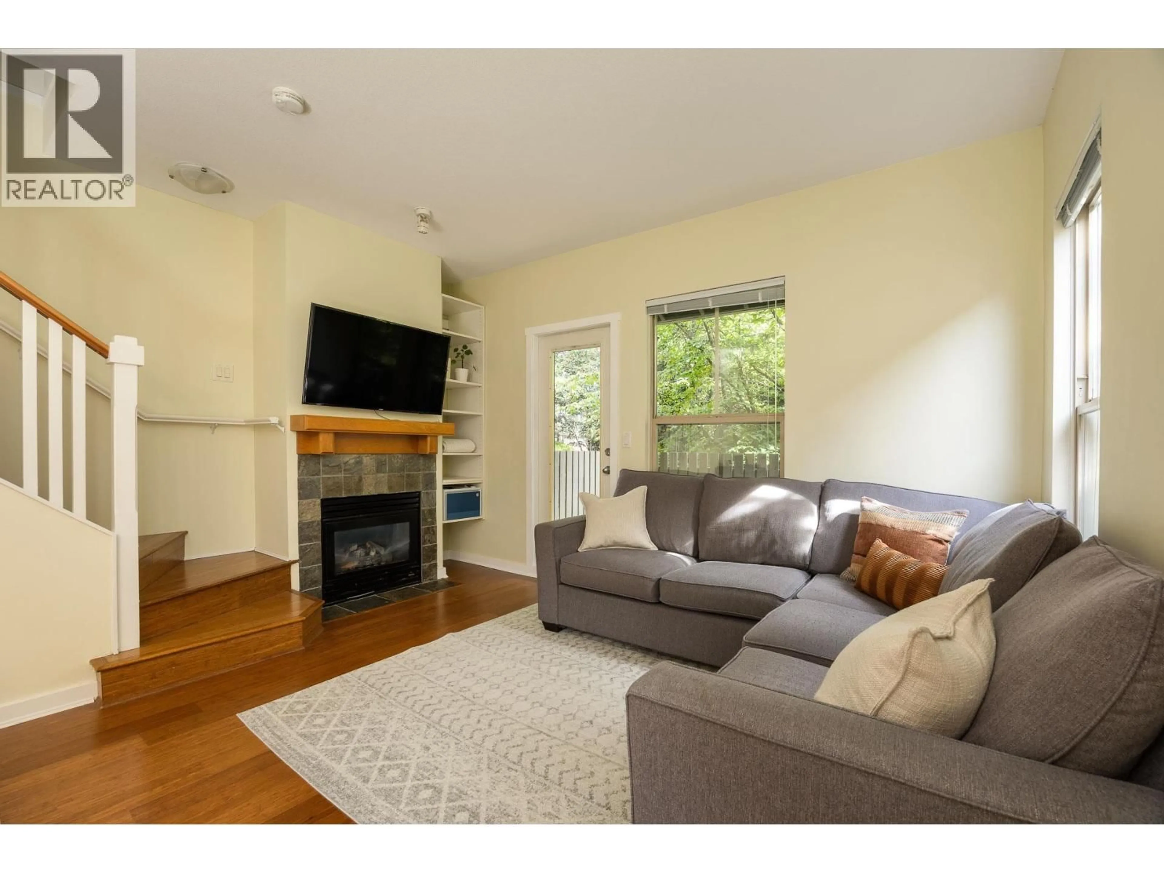 Living room with furniture, wood/laminate floor for 237 - 18 JACK MAHONY PLACE, New Westminster British Columbia V3L5V8