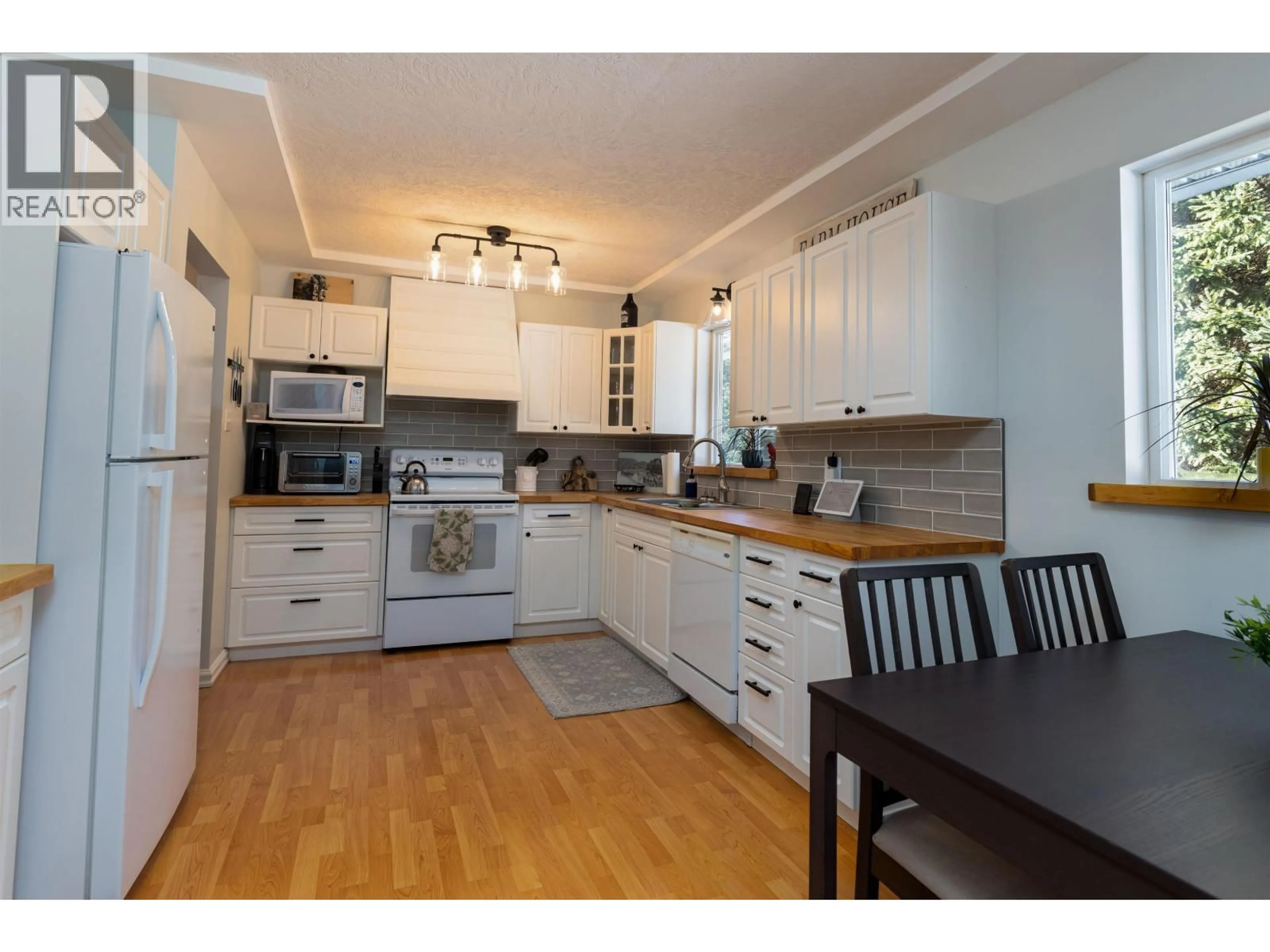 Open concept kitchen, wood/laminate floor for 5515 KLEANZA DRIVE, Terrace British Columbia V8G0A7