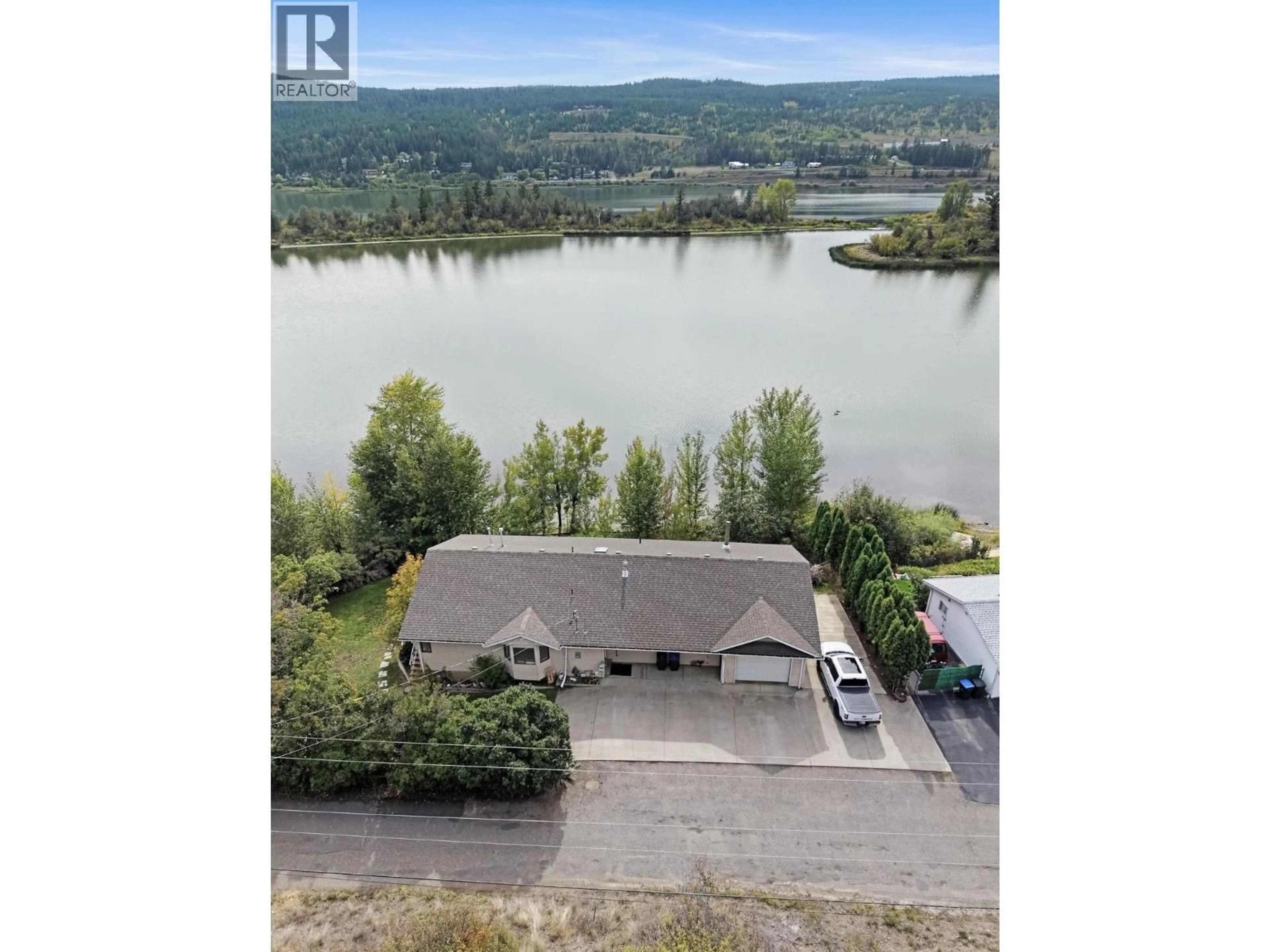 A pic from outside/outdoor area/front of a property/back of a property/a pic from drone, water/lake/river/ocean view for 1555 DUNCAN ROAD, Williams Lake British Columbia V2G5K5