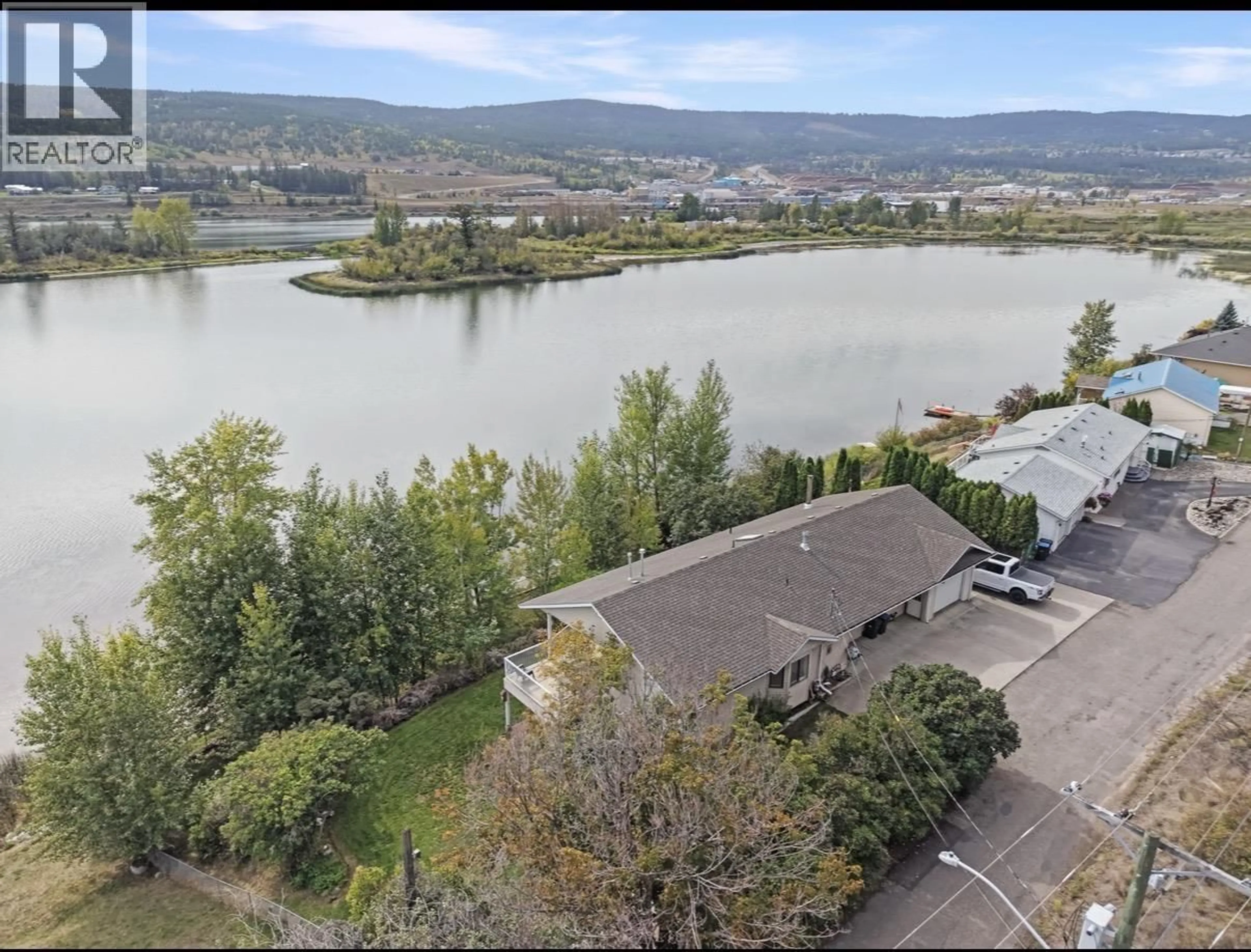 A pic from outside/outdoor area/front of a property/back of a property/a pic from drone, water/lake/river/ocean view for 1555 DUNCAN ROAD, Williams Lake British Columbia V2G5K5