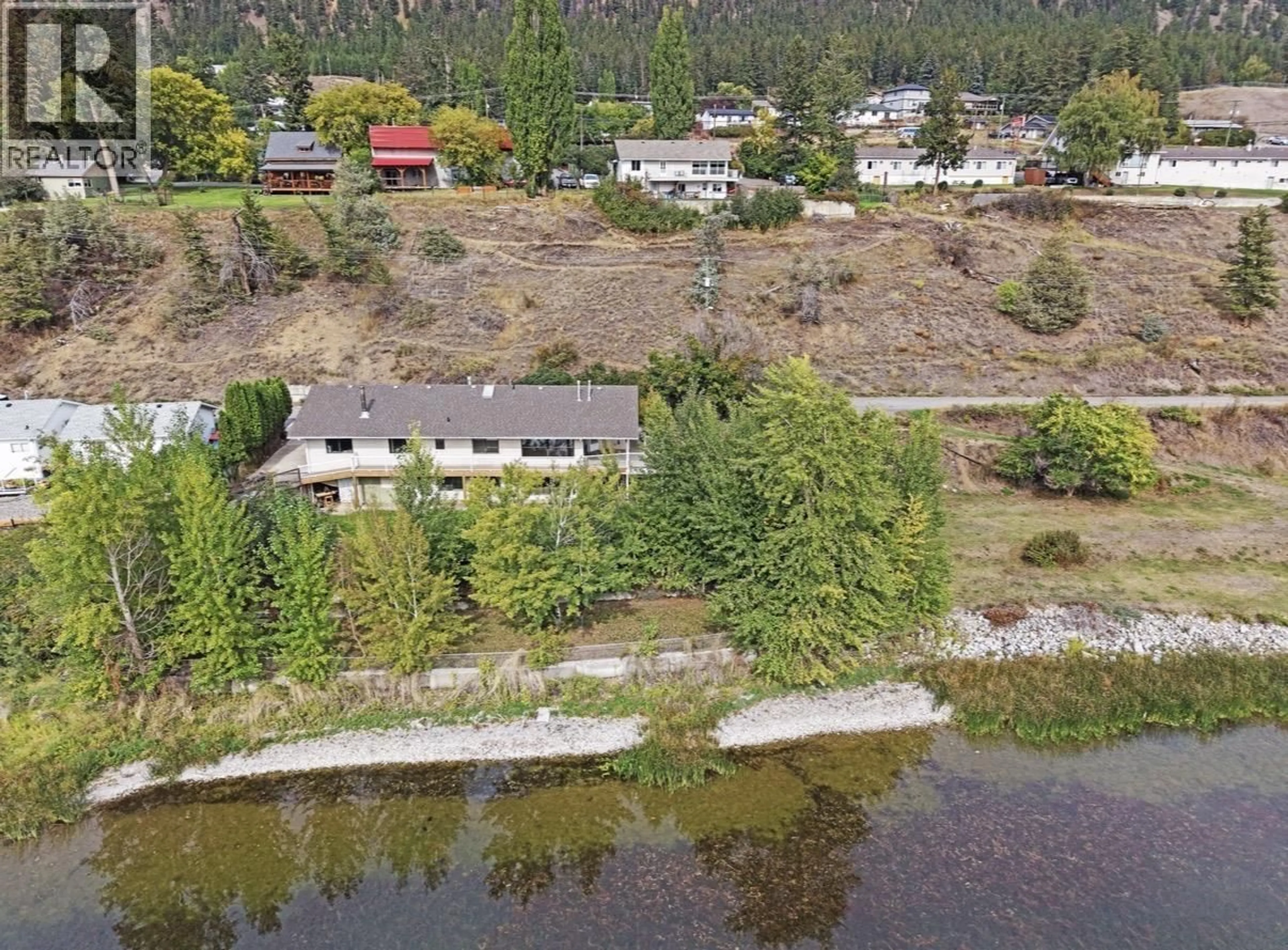 A pic from outside/outdoor area/front of a property/back of a property/a pic from drone, water/lake/river/ocean view for 1555 DUNCAN ROAD, Williams Lake British Columbia V2G5K5