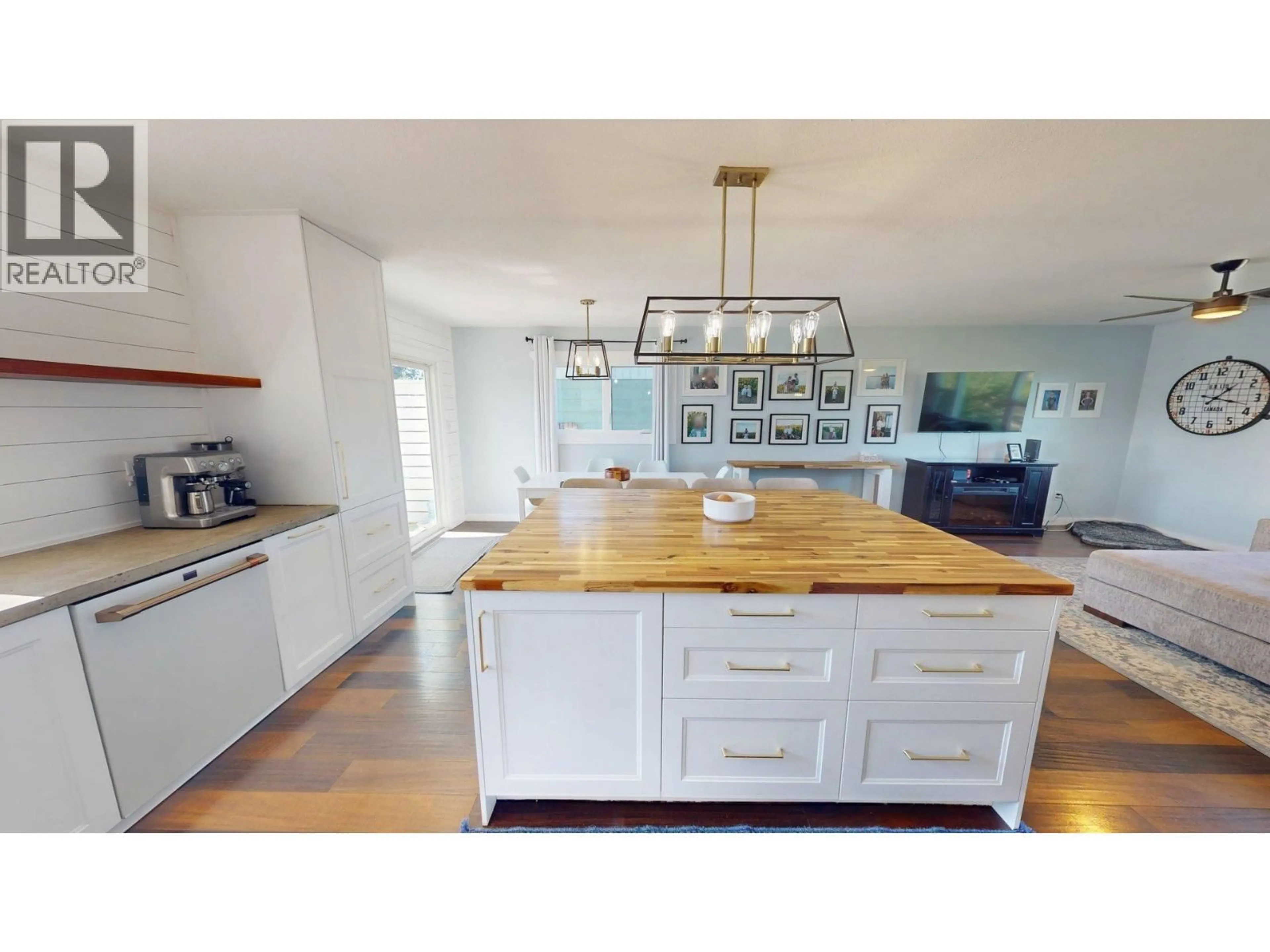 Open concept kitchen, wood/laminate floor for 8111 96 AVENUE, Fort St. John British Columbia V1J1J5