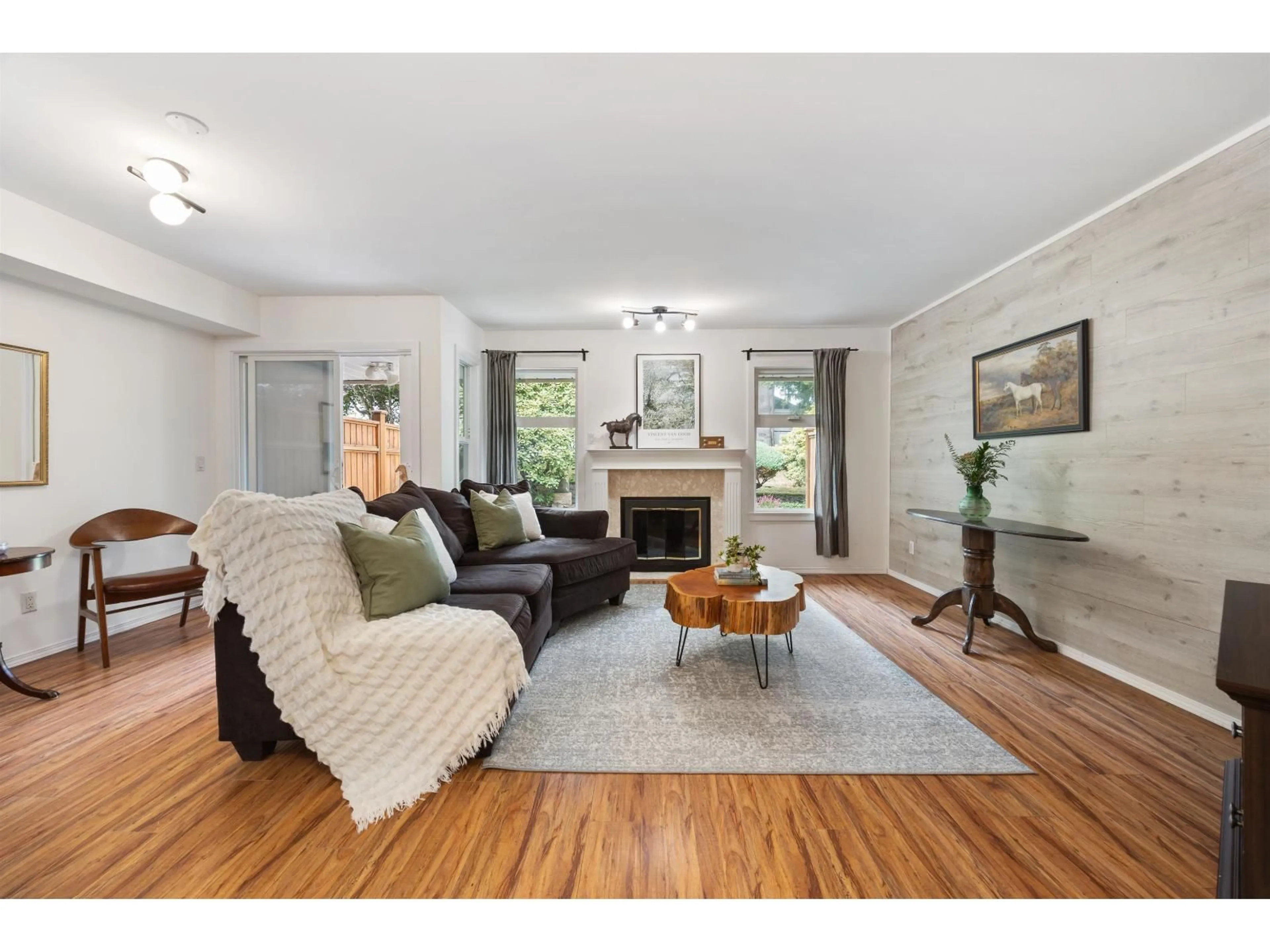 Living room with furniture, wood/laminate floor for 126 - 9045 WALNUT GROVE DRIVE, Langley British Columbia V1M2E1