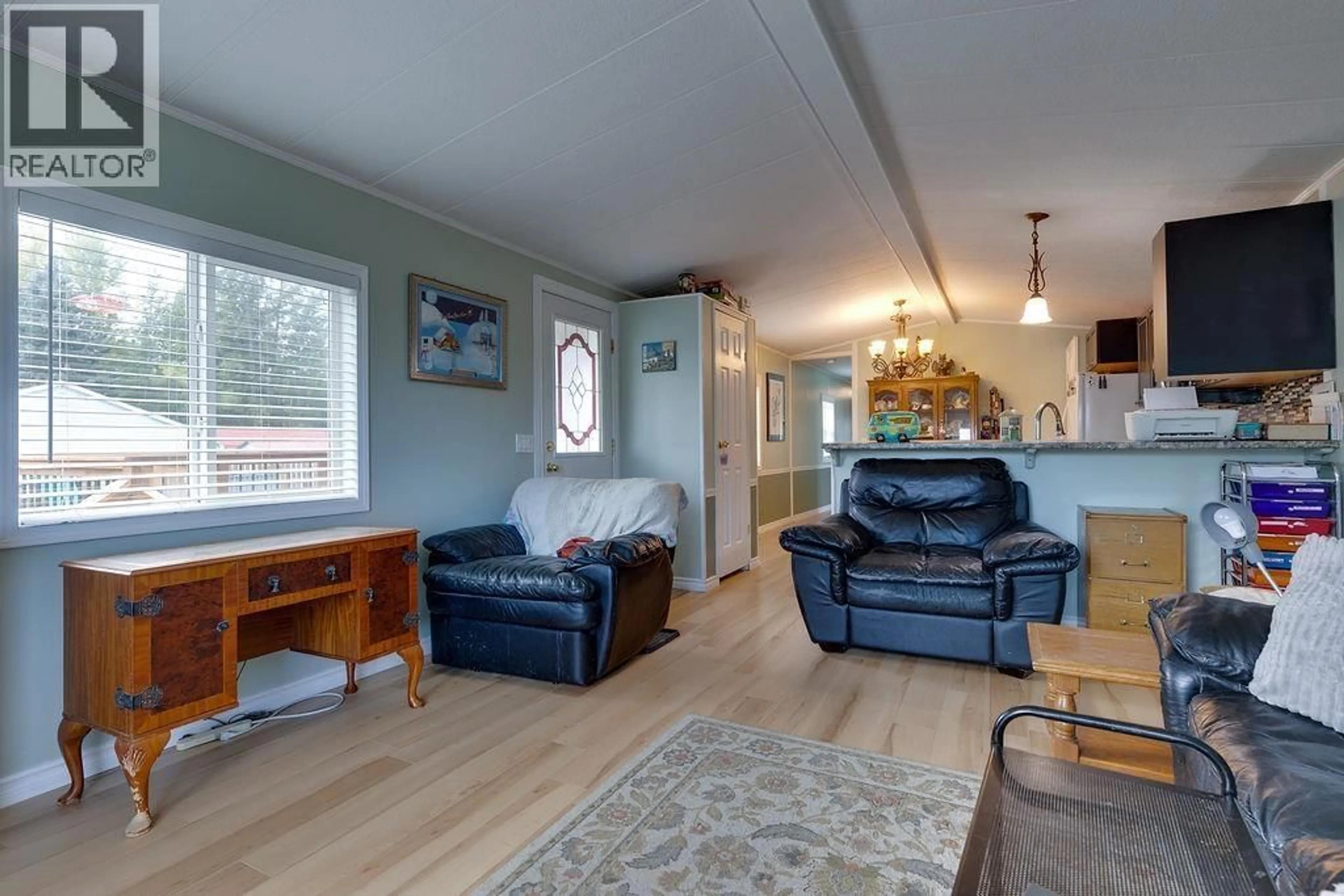 Living room with furniture, wood/laminate floor for 7167 ALDEEN ROAD, Prince George British Columbia V2N5P7