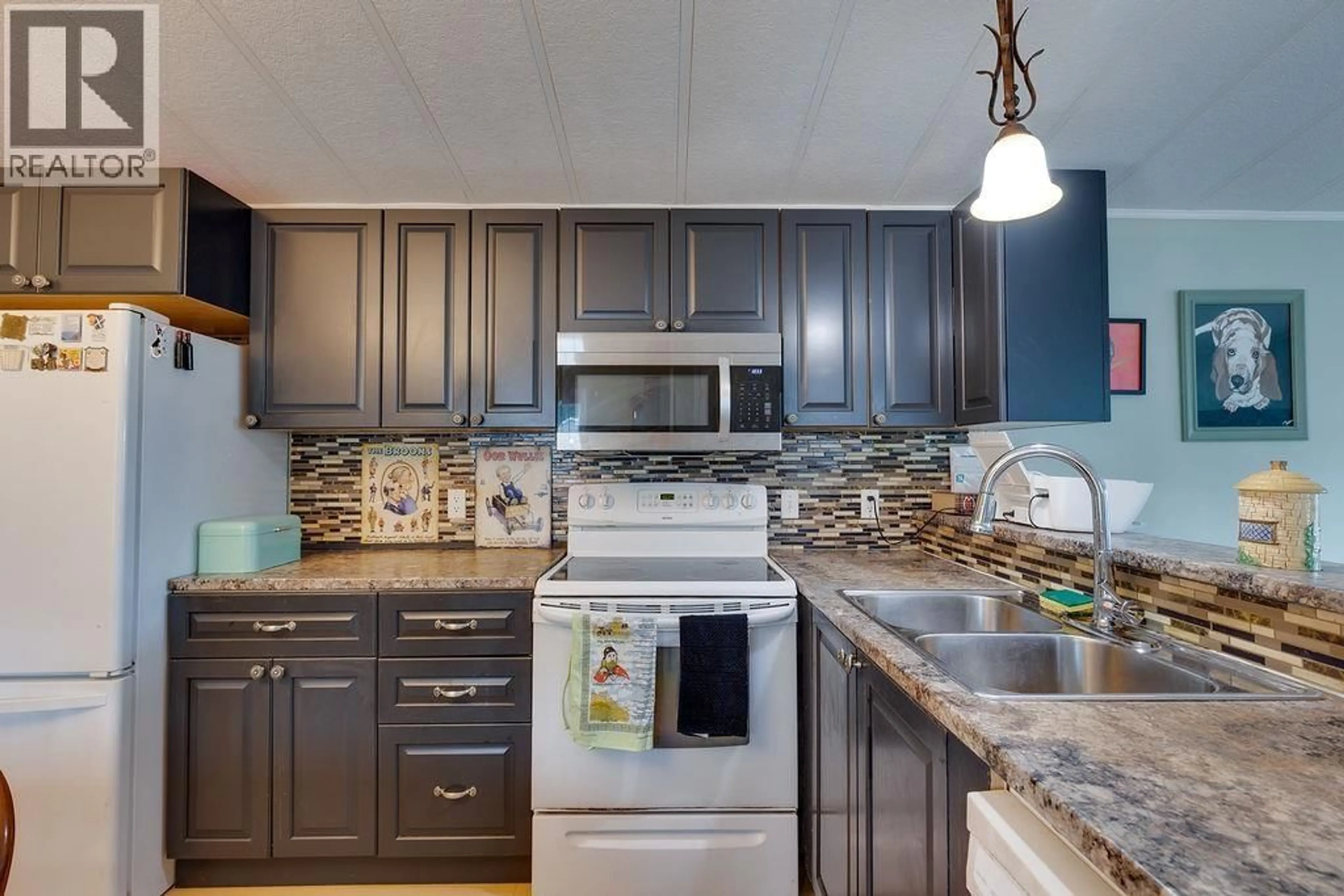 Open concept kitchen, ceramic/tile floor for 7167 ALDEEN ROAD, Prince George British Columbia V2N5P7