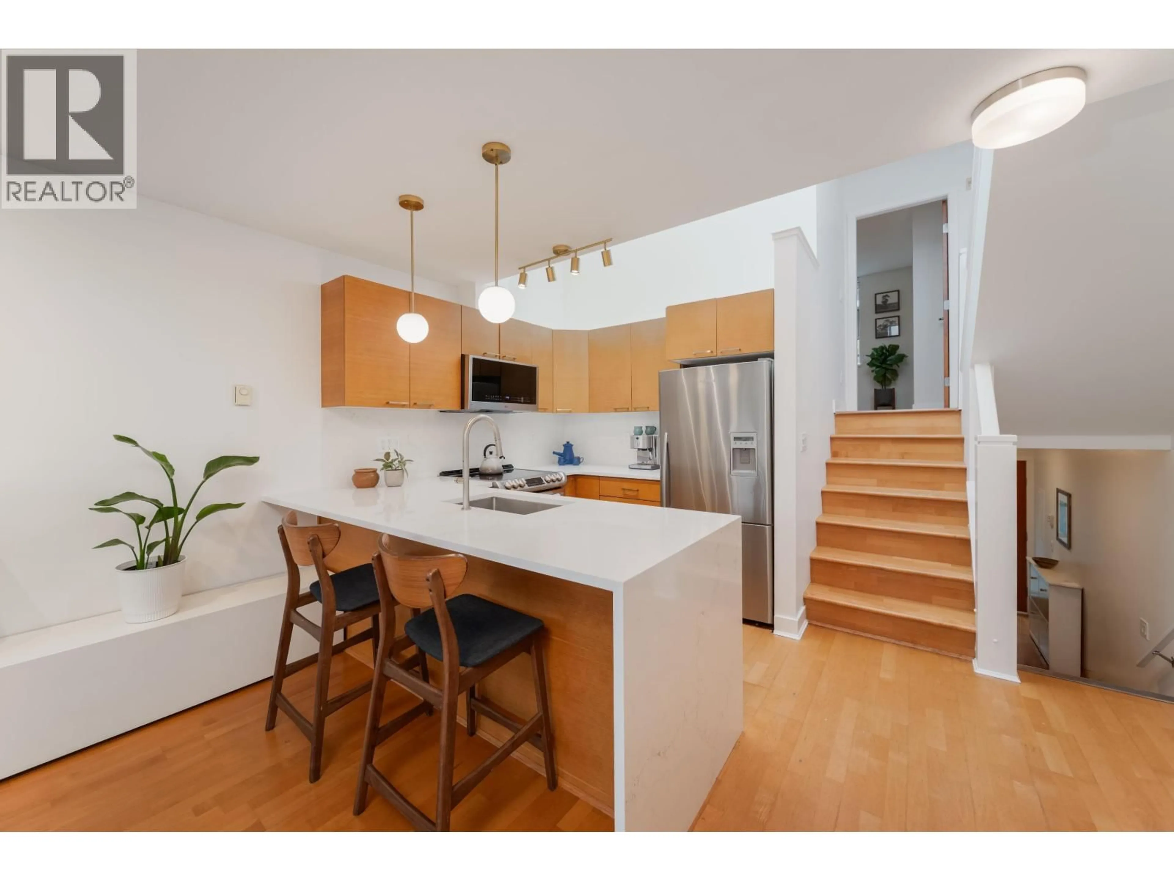 Open concept kitchen, wood/laminate floor for 9 - 1250 6TH AVENUE, Vancouver British Columbia V6H1A5
