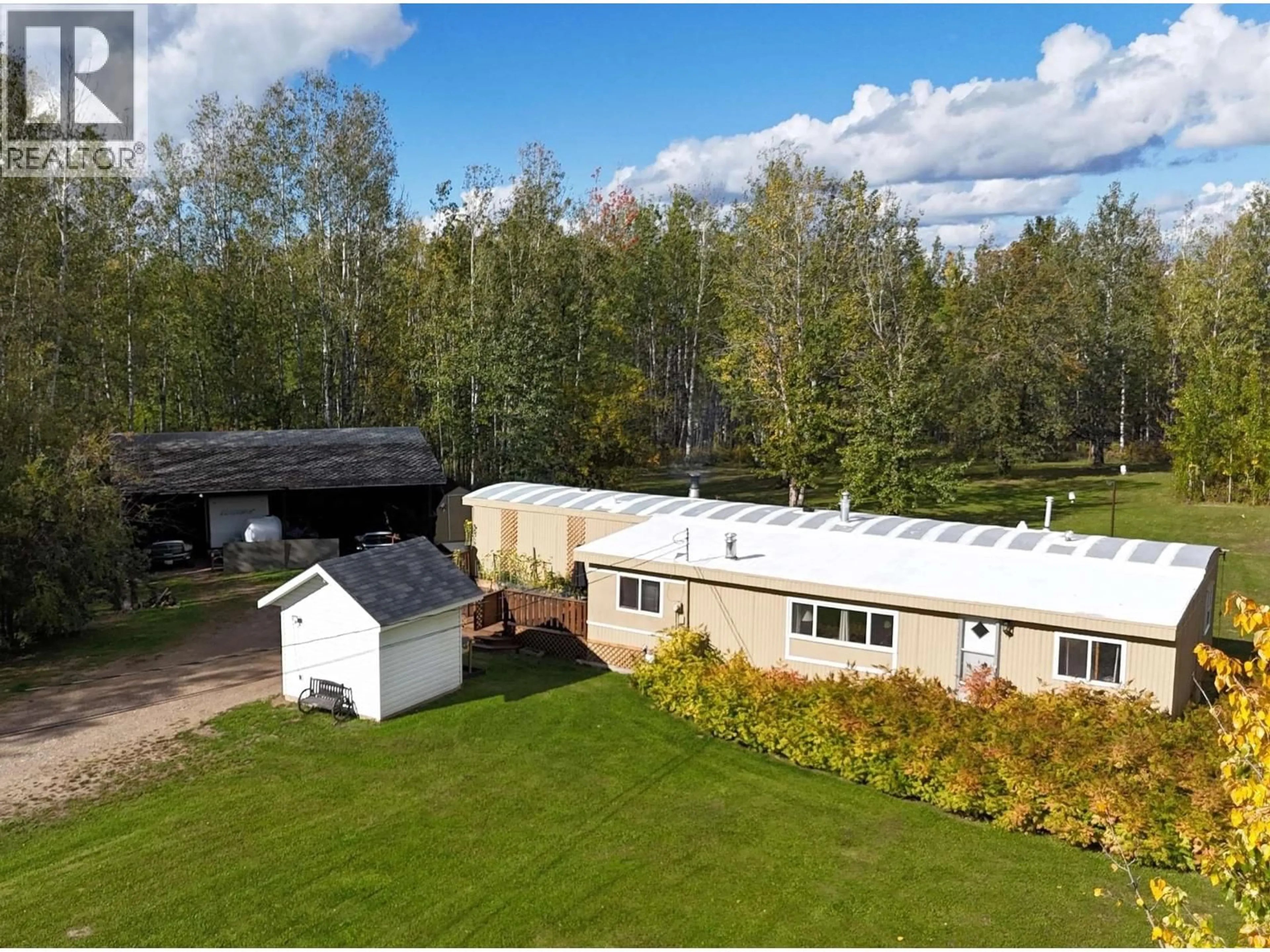 A pic from outside/outdoor area/front of a property/back of a property/a pic from drone, building for 8 FEDIW ROAD, Fort Nelson British Columbia V0C1R0