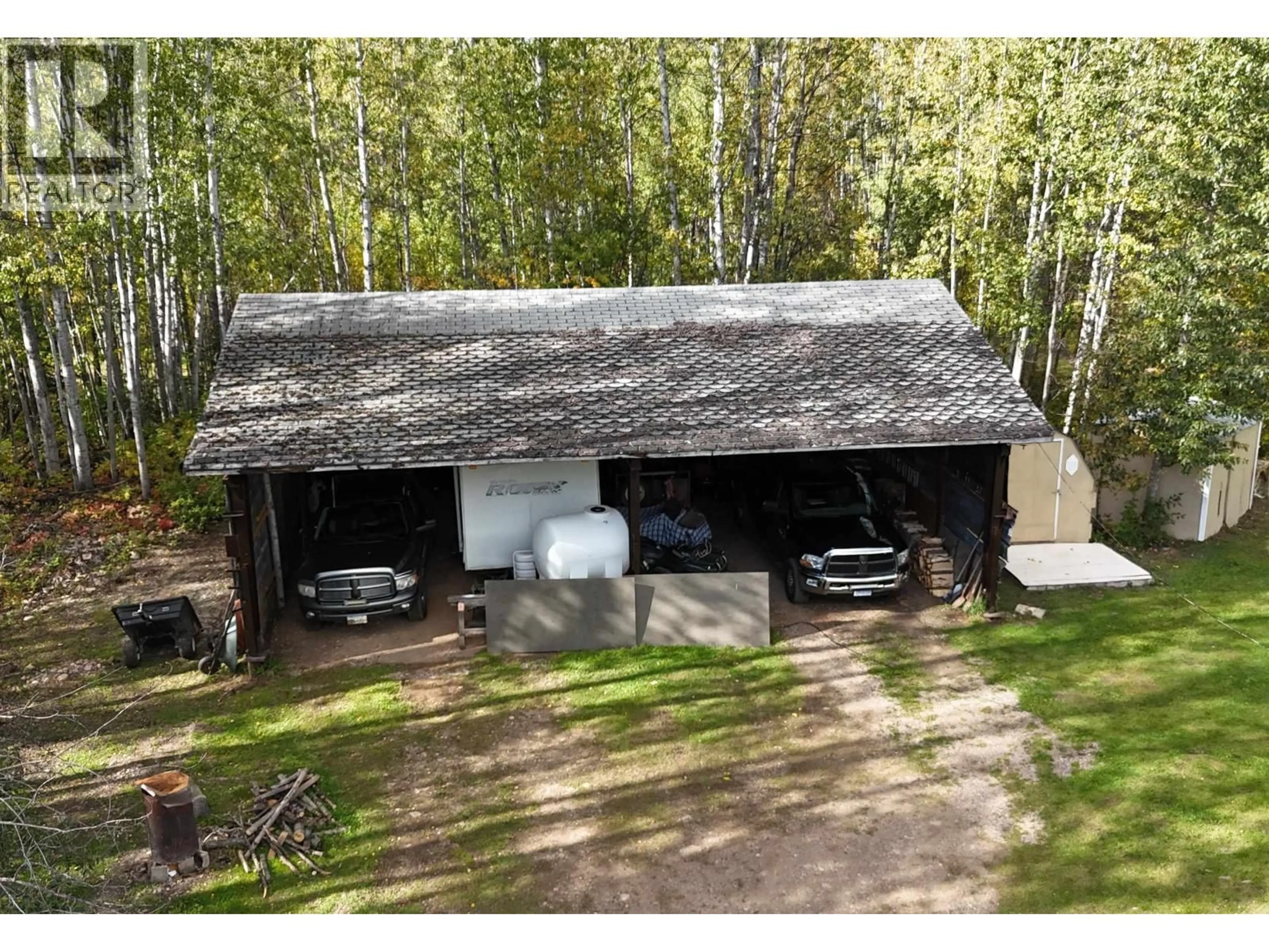 A pic from outside/outdoor area/front of a property/back of a property/a pic from drone, forest/trees view for 8 FEDIW ROAD, Fort Nelson British Columbia V0C1R0