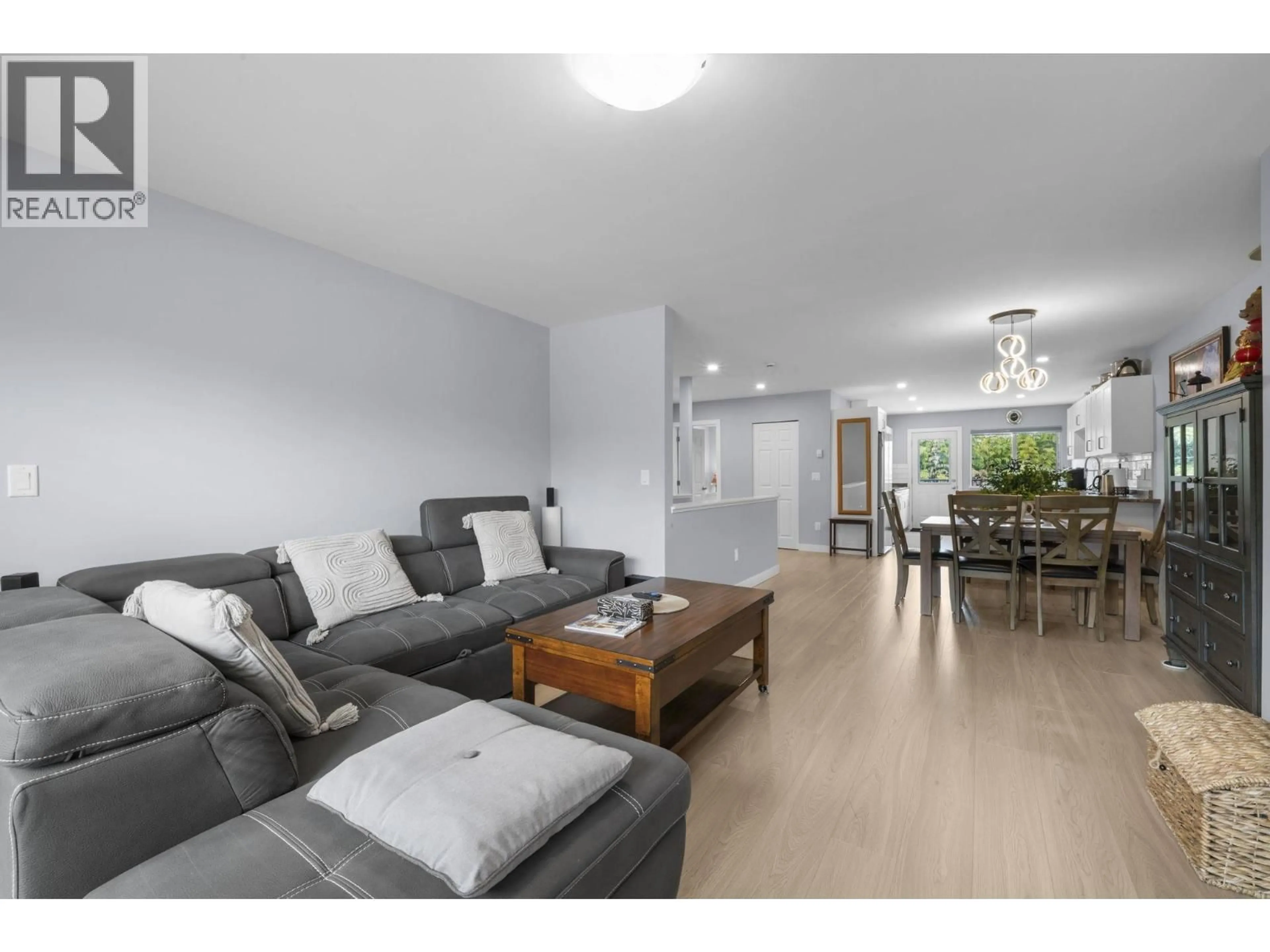 Living room with furniture, wood/laminate floor for 7737 ALLMAN STREET, Burnaby British Columbia V5E2A9