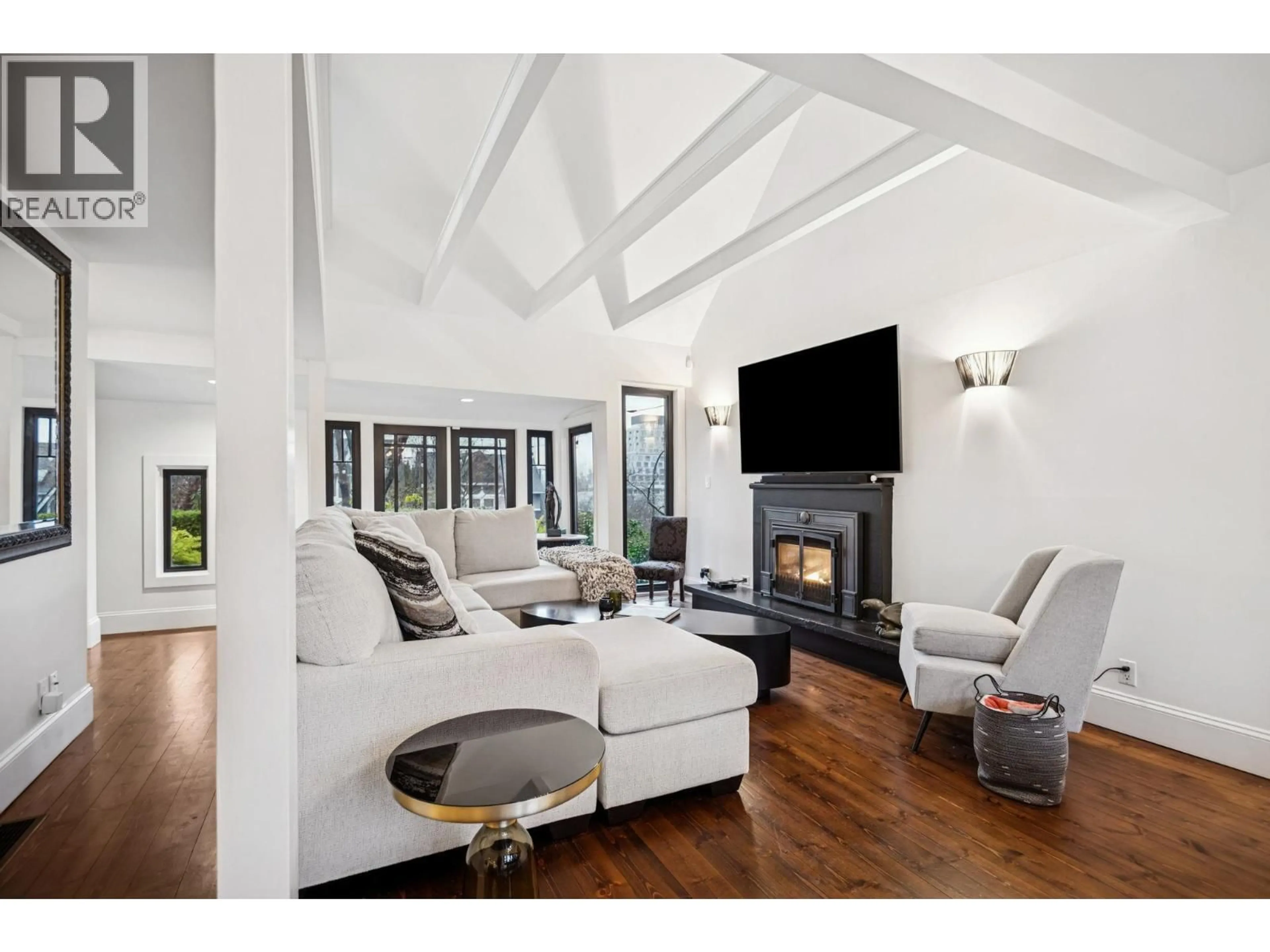 Living room with furniture, wood/laminate floor for 3814 11 AVENUE, Vancouver British Columbia V6R2K9