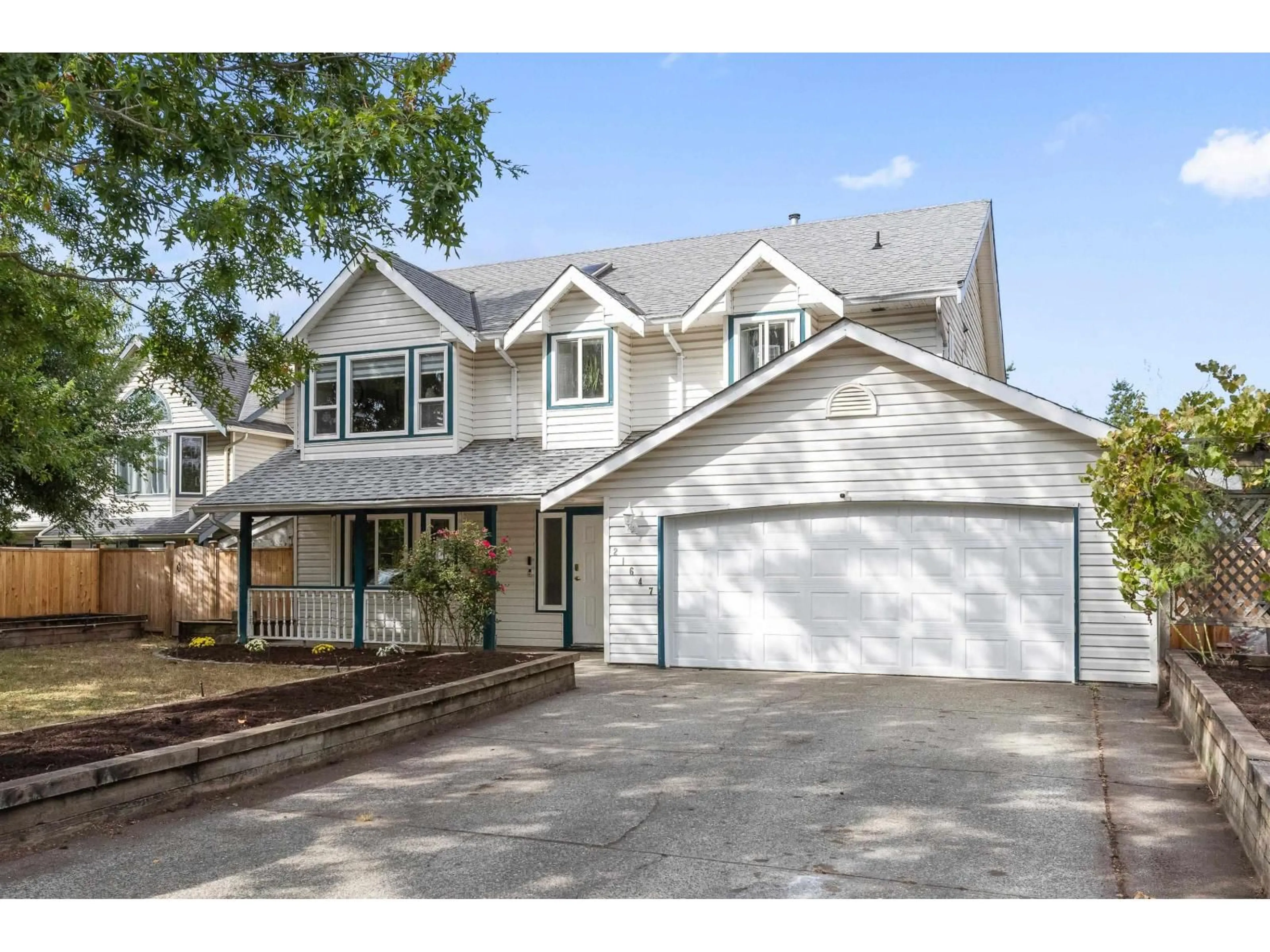 Home with vinyl exterior material, street for 21647 50A AVENUE, Langley British Columbia V3A8W9