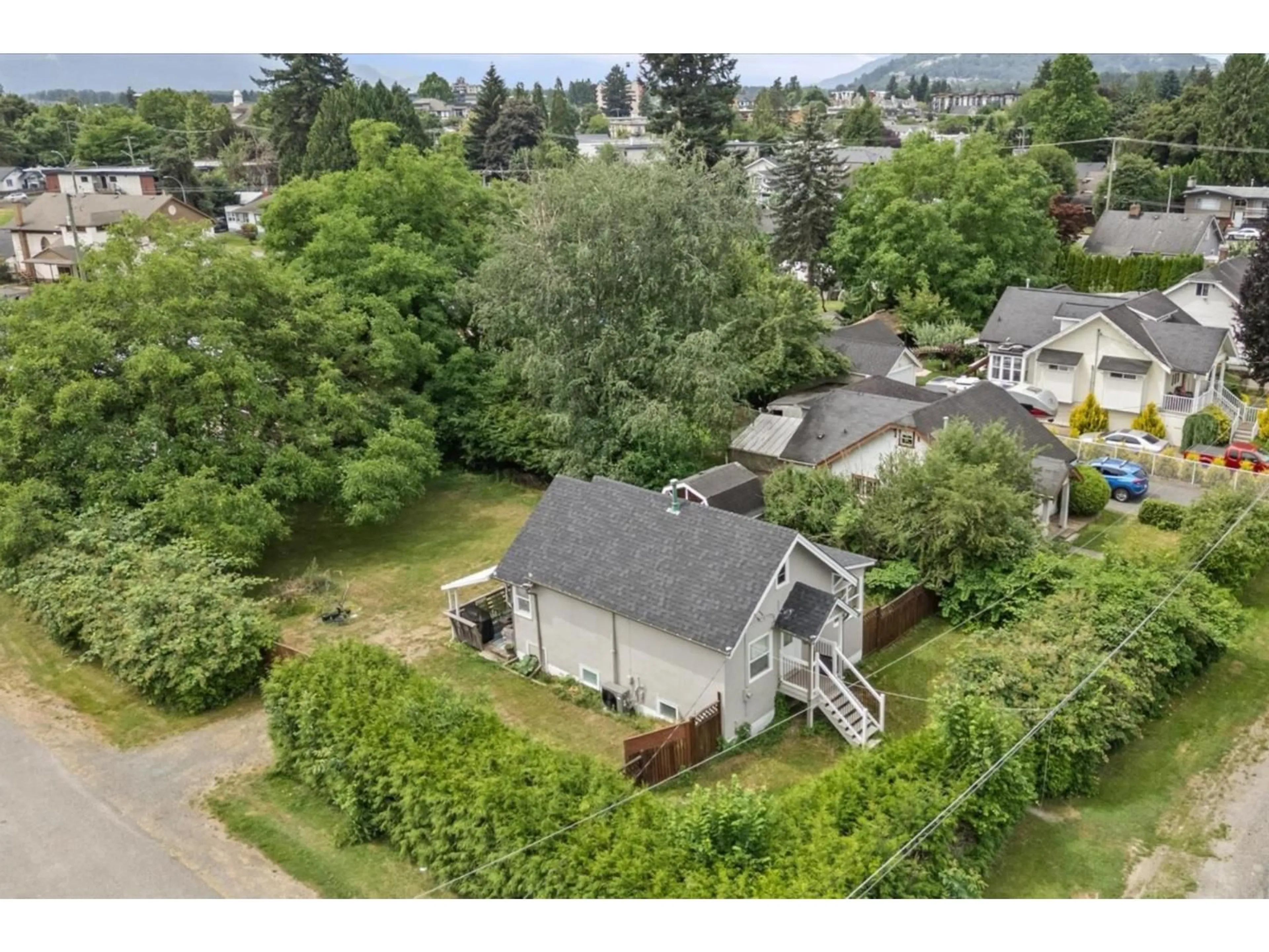 A pic from outside/outdoor area/front of a property/back of a property/a pic from drone, mountain view for 46028 KING AVENUE, Chilliwack British Columbia V2P3B4