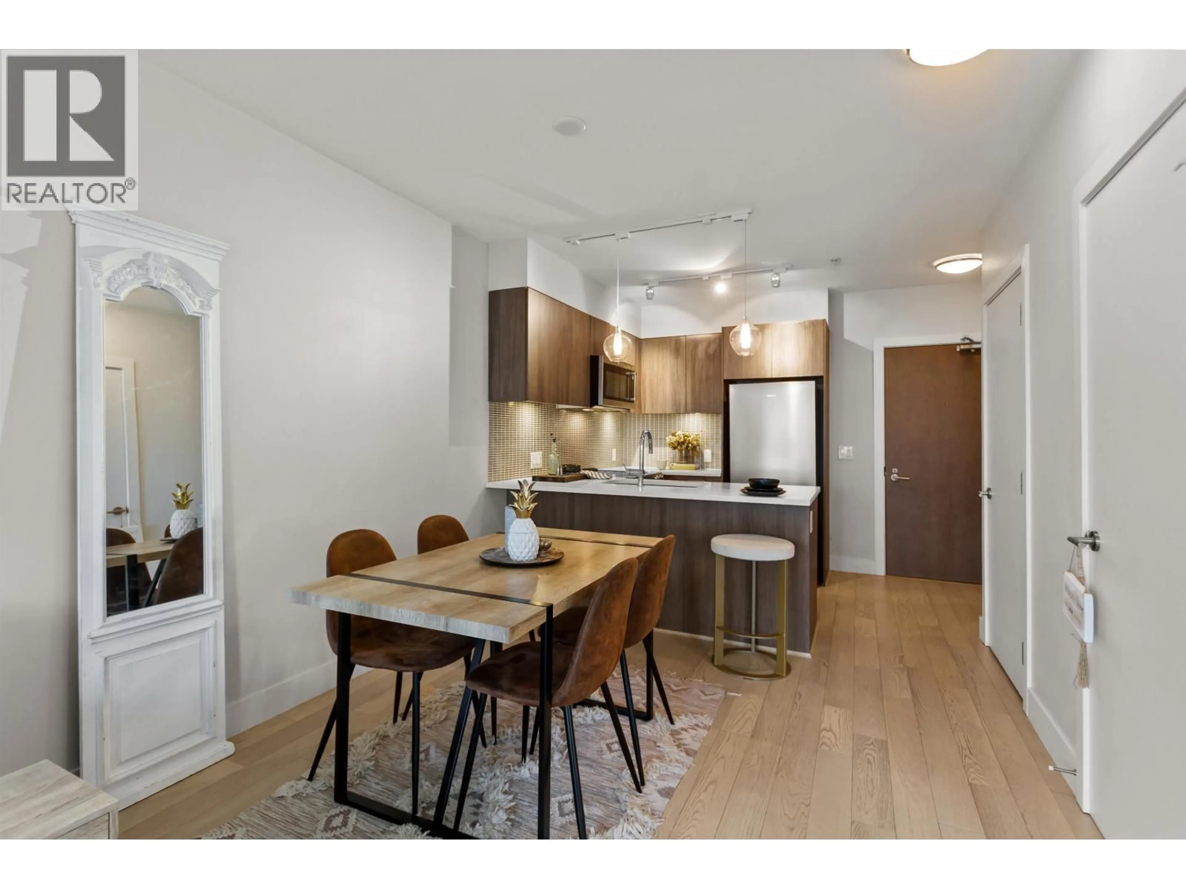 Open concept kitchen, wood/laminate floor for 509 - 2477 CAROLINA STREET, Vancouver British Columbia V5T0G8