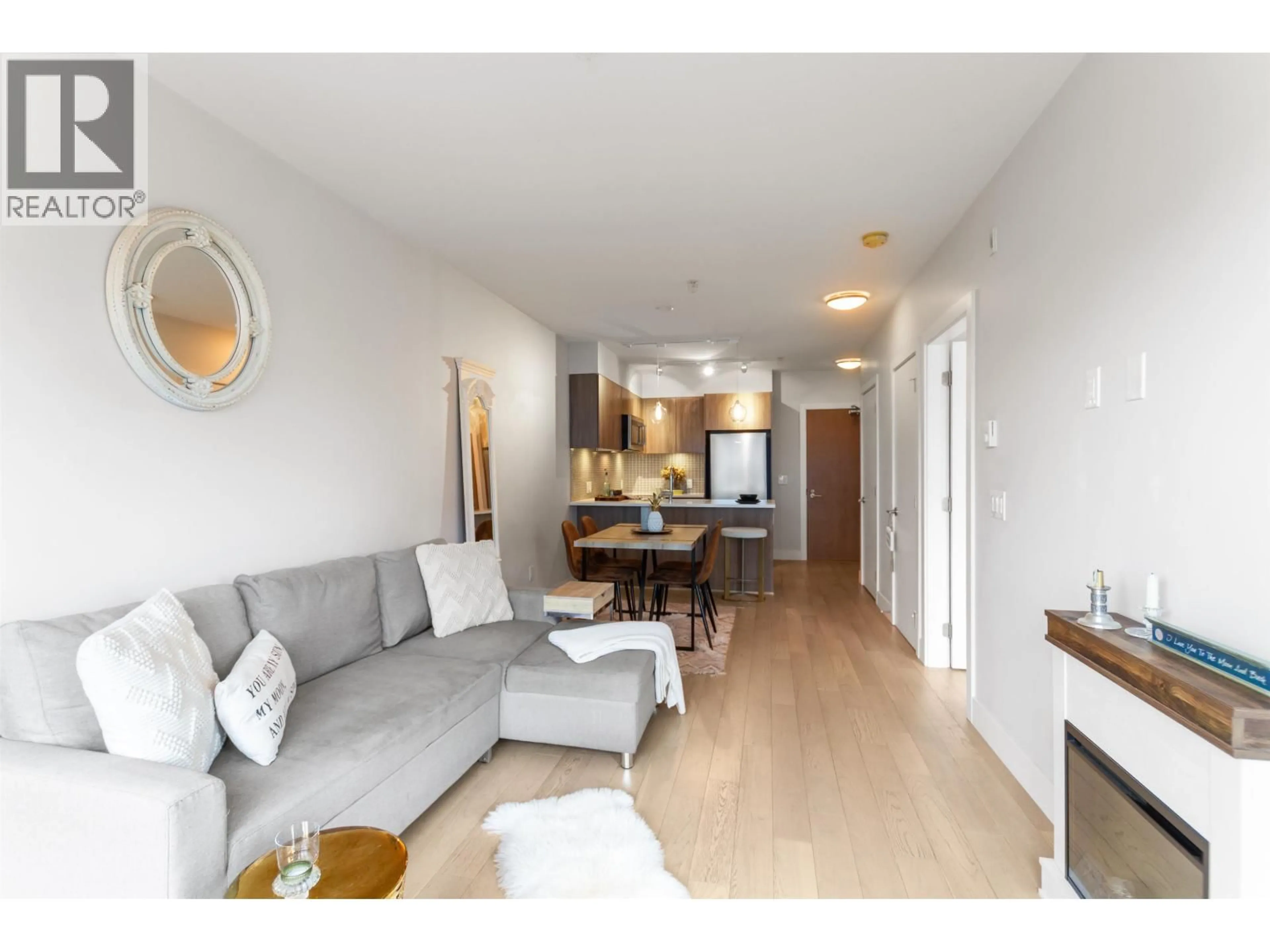 Living room with furniture, wood/laminate floor for 509 - 2477 CAROLINA STREET, Vancouver British Columbia V5T0G8