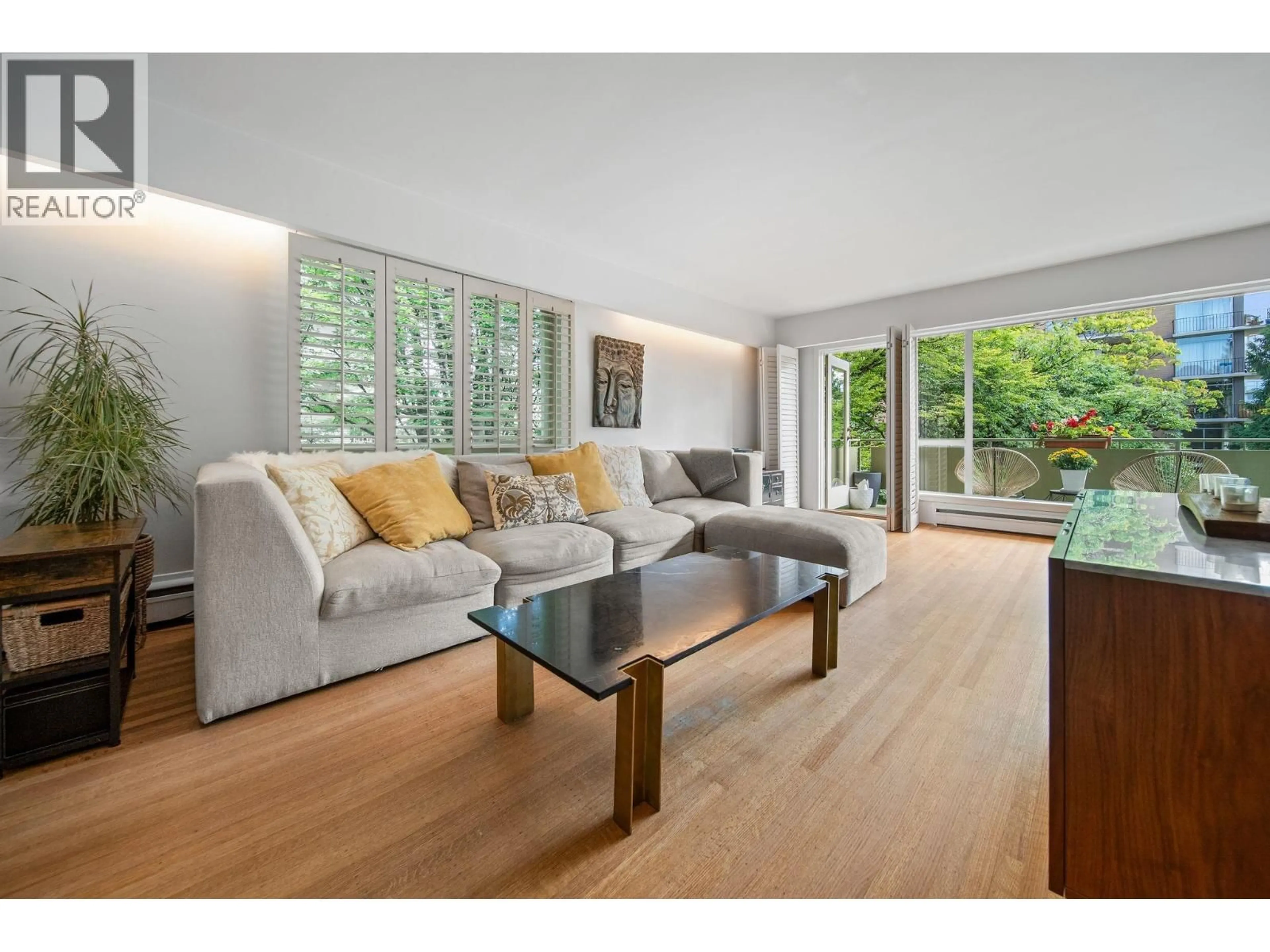 Living room with furniture, wood/laminate floor for 204 - 5475 VINE STREET, Vancouver British Columbia V6M3Z7