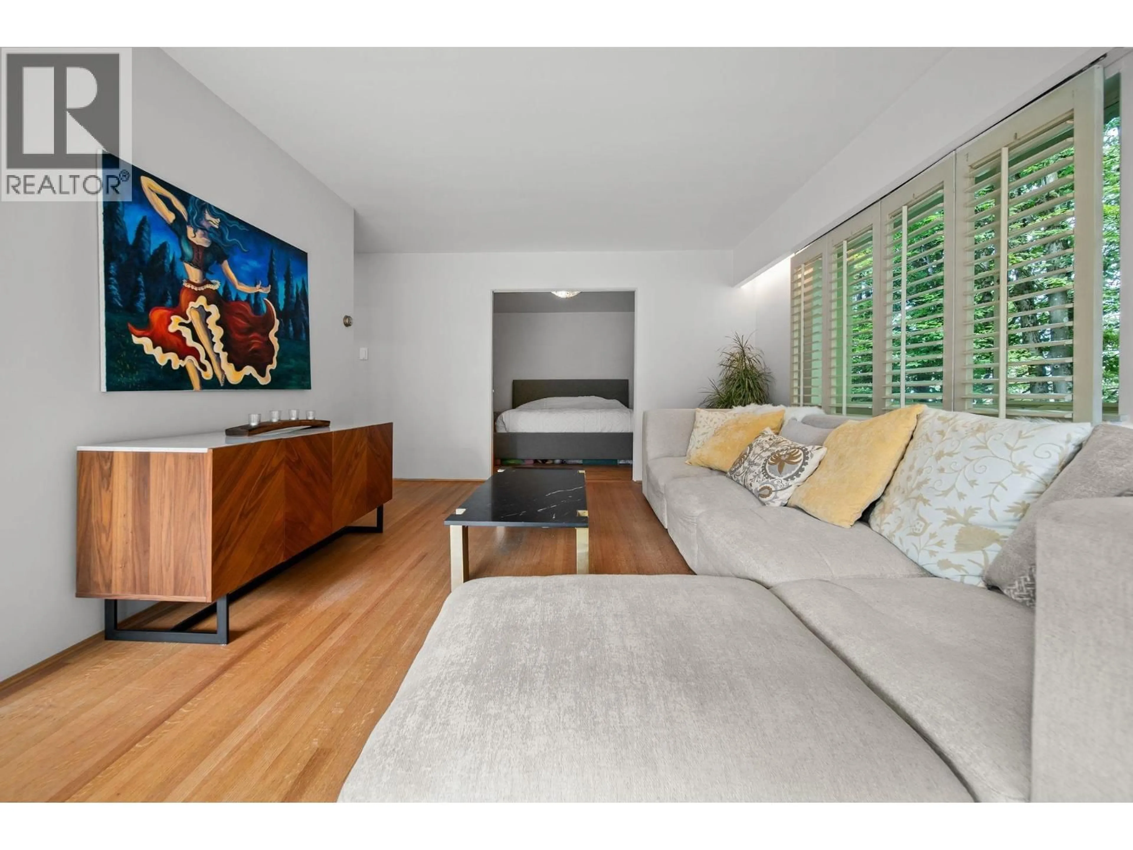 Living room with furniture, wood/laminate floor for 204 - 5475 VINE STREET, Vancouver British Columbia V6M3Z7