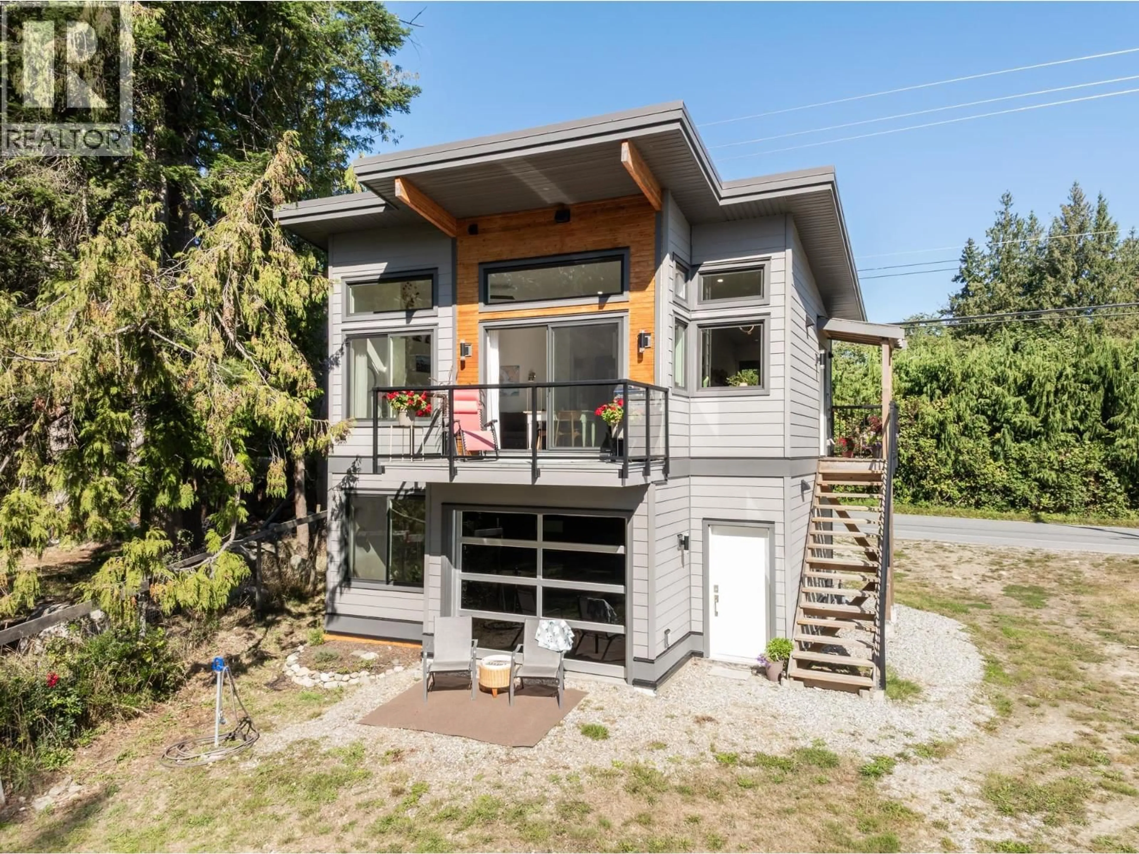 Home with vinyl exterior material, street for 7835 REDROOFFS ROAD, Halfmoon Bay British Columbia V7Z1A4