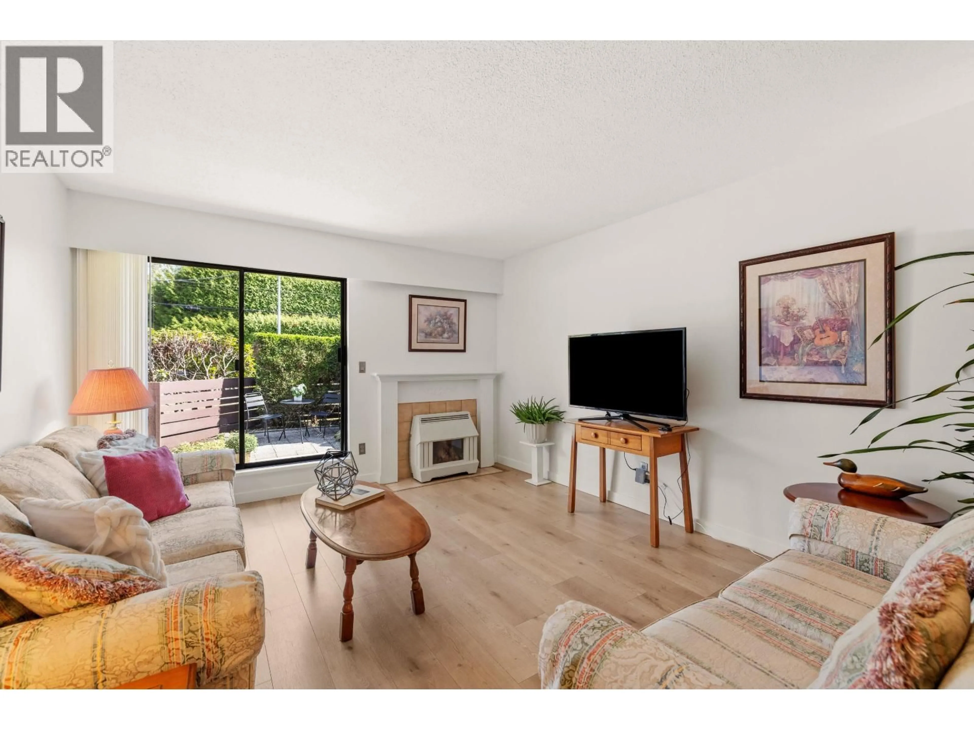 Living room with furniture, wood/laminate floor for 3455 COAST MERIDIAN ROAD, Port Coquitlam British Columbia V3B3N7