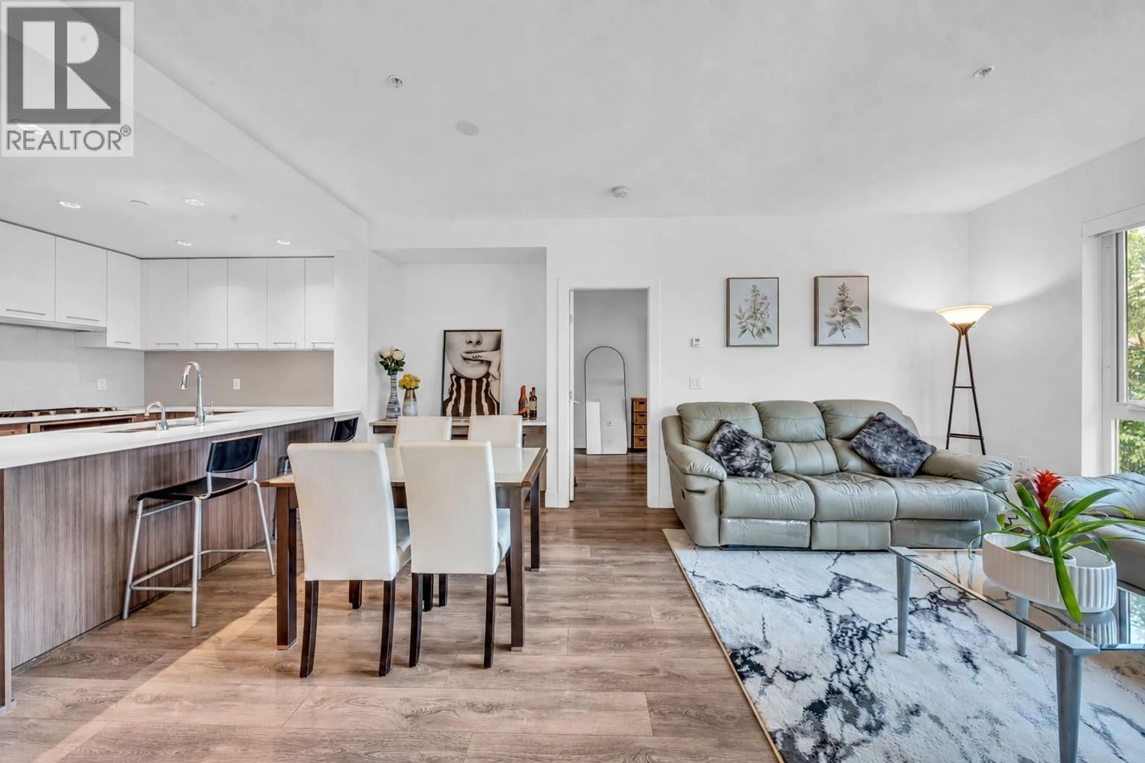 Living room with furniture, wood/laminate floor for 307 - 8580 RIVER DISTRICT CROSSING, Vancouver British Columbia V5S0B9
