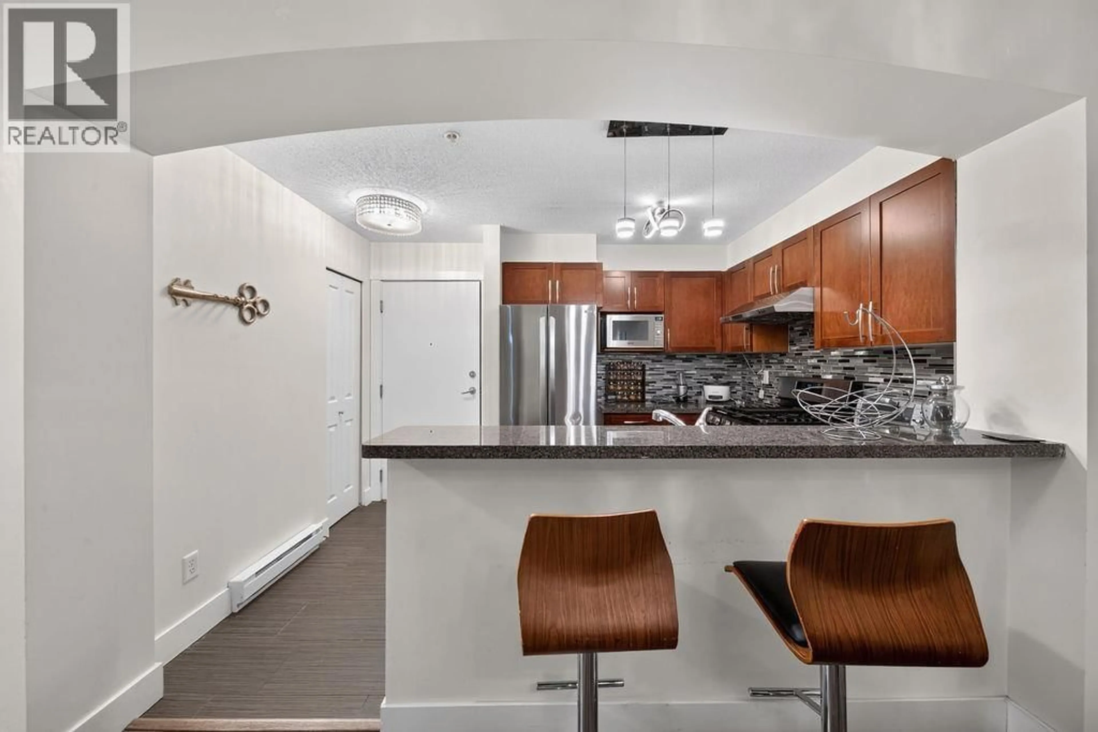 Open concept kitchen, ceramic/tile floor for 105 - 5740 TORONTO ROAD, Vancouver British Columbia V6T1L2