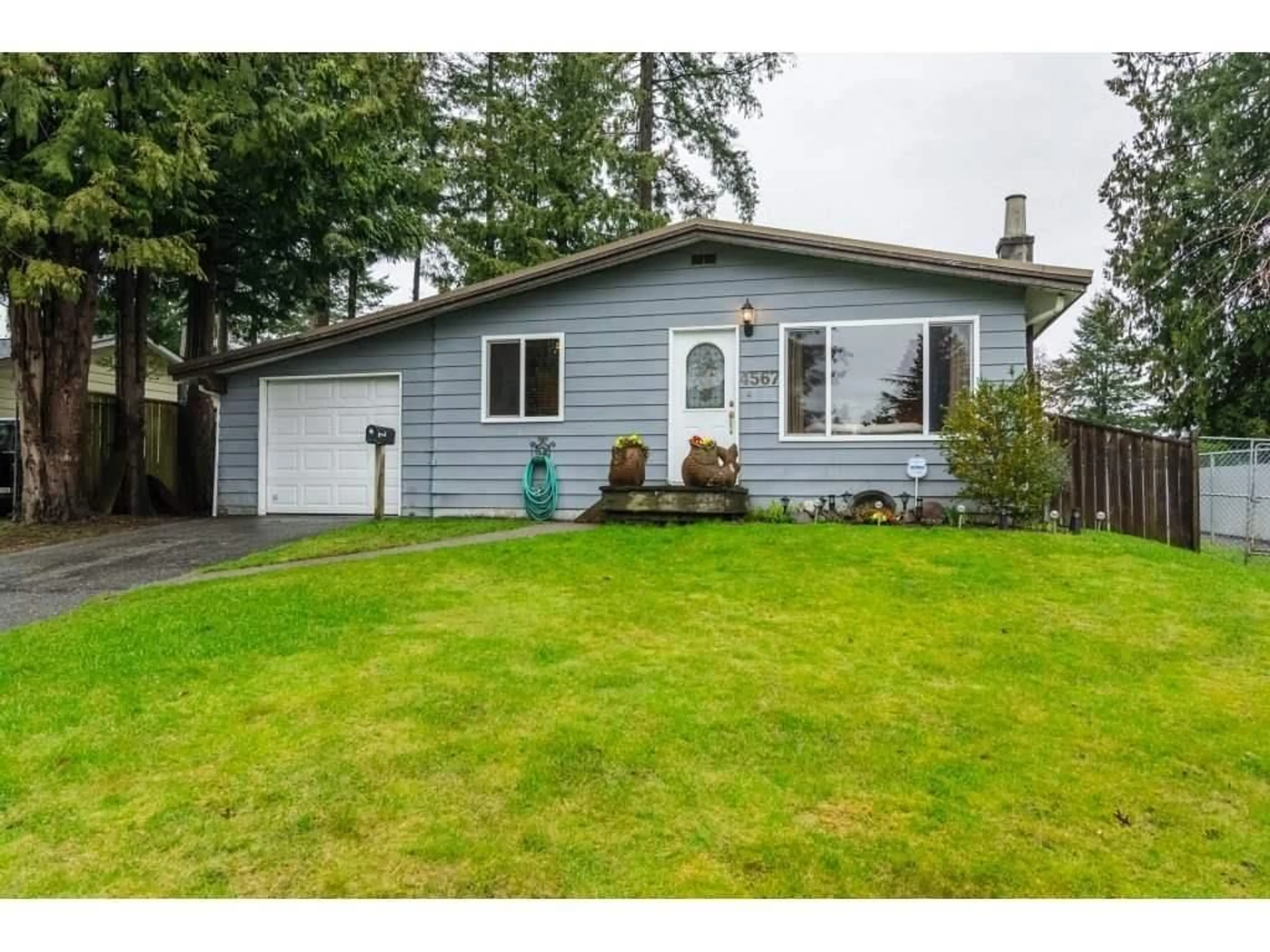 Home with vinyl exterior material, street for 4567 202 STREET, Langley British Columbia V3A6M6